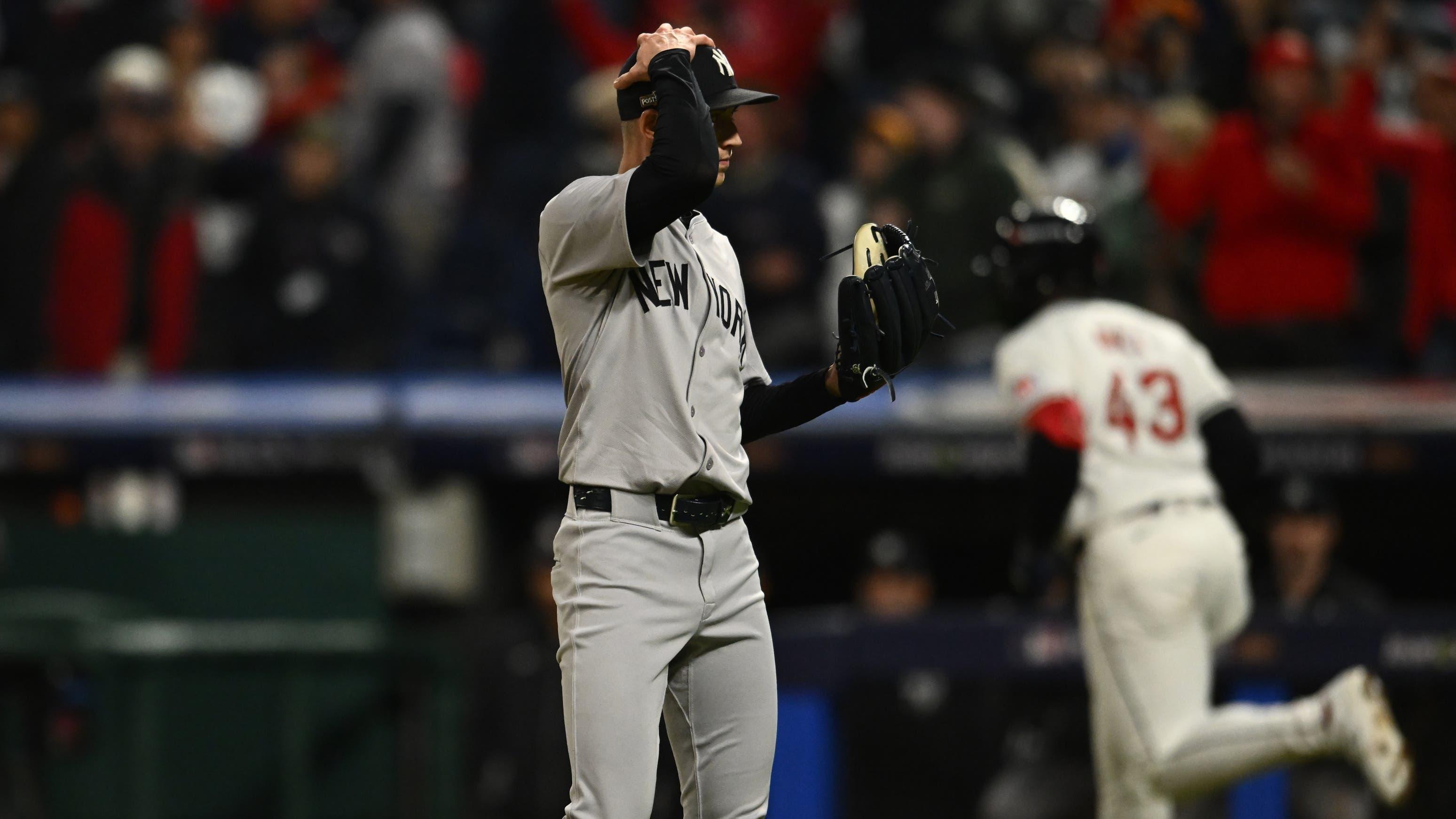 Oct 17, 2024; Cleveland, Ohio, USA; New York Yankees pitcher Luke Weaver (30) reacts after giving up a home run during the ninth inning against the Cleveland Guardians in game 3 of the American League Championship Series at Progressive Field. / Ken Blaze-Imagn Images