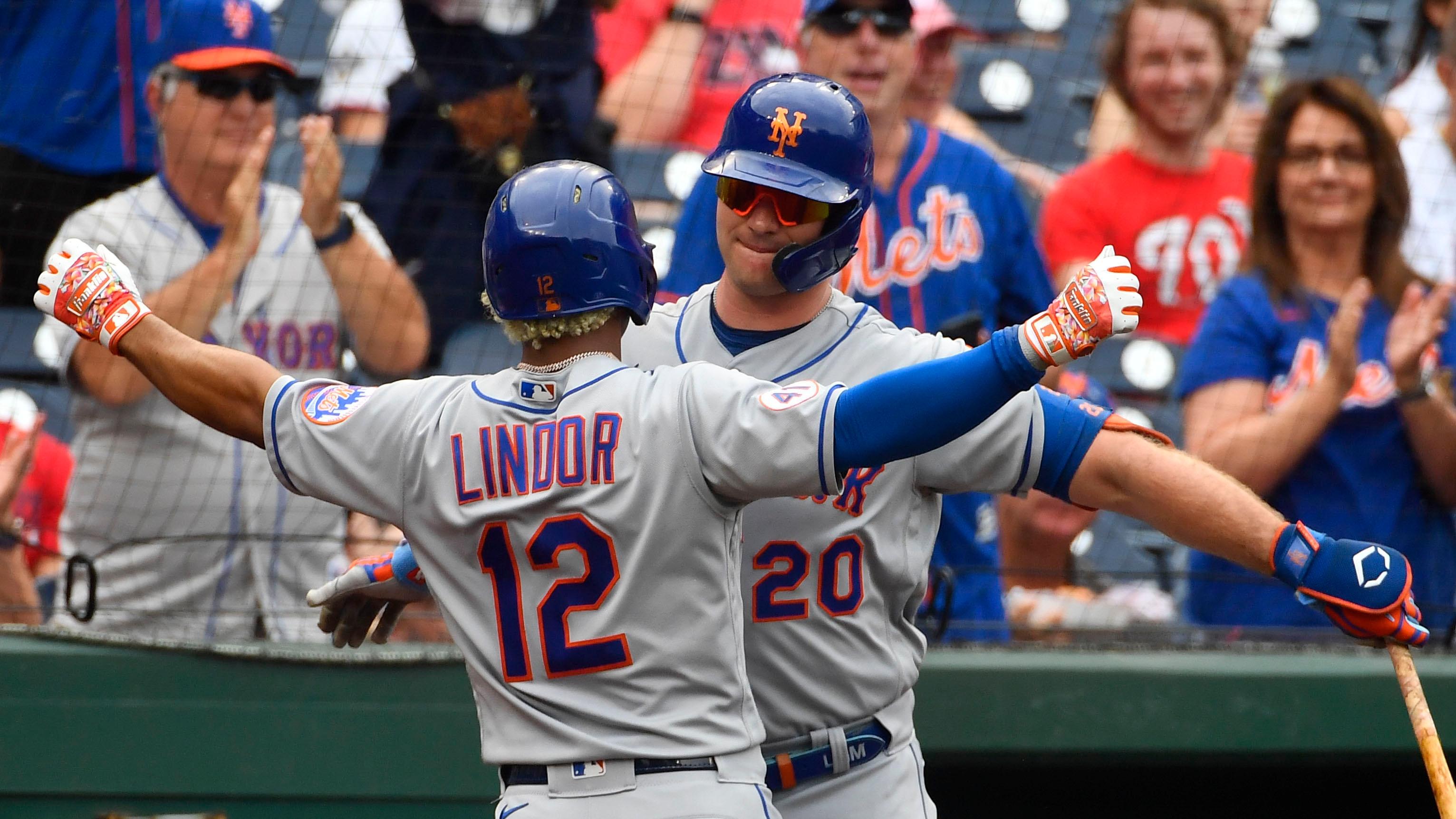 Jun 19, 2021; Washington, District of Columbia, USA; New York Mets shortstop Francisco Lindor (12) is congratulated by first baseman Pete Alonso (20) after hitting a two run home run against the Washington Nationals during the first inning at Nationals Park.