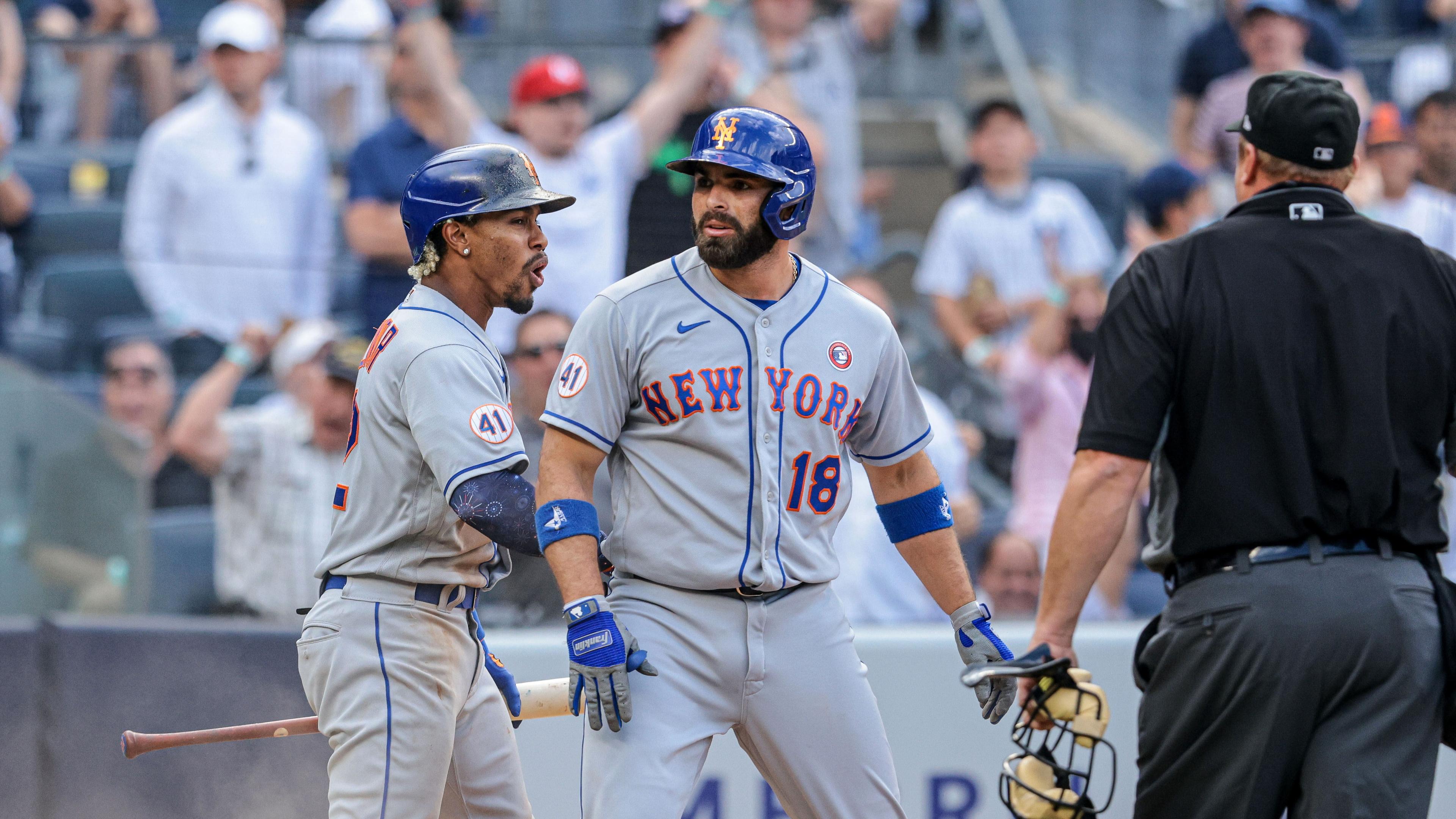 Jul 4, 2021; Bronx, New York, USA; New York Mets second baseman Jose Peraza (18) celebrates with shortstop Francisco Lindor (12) after scoring a during the seventh inning against the New York Yankees at Yankee Stadium. Mandatory Credit: Vincent Carchietta-USA TODAY Sports