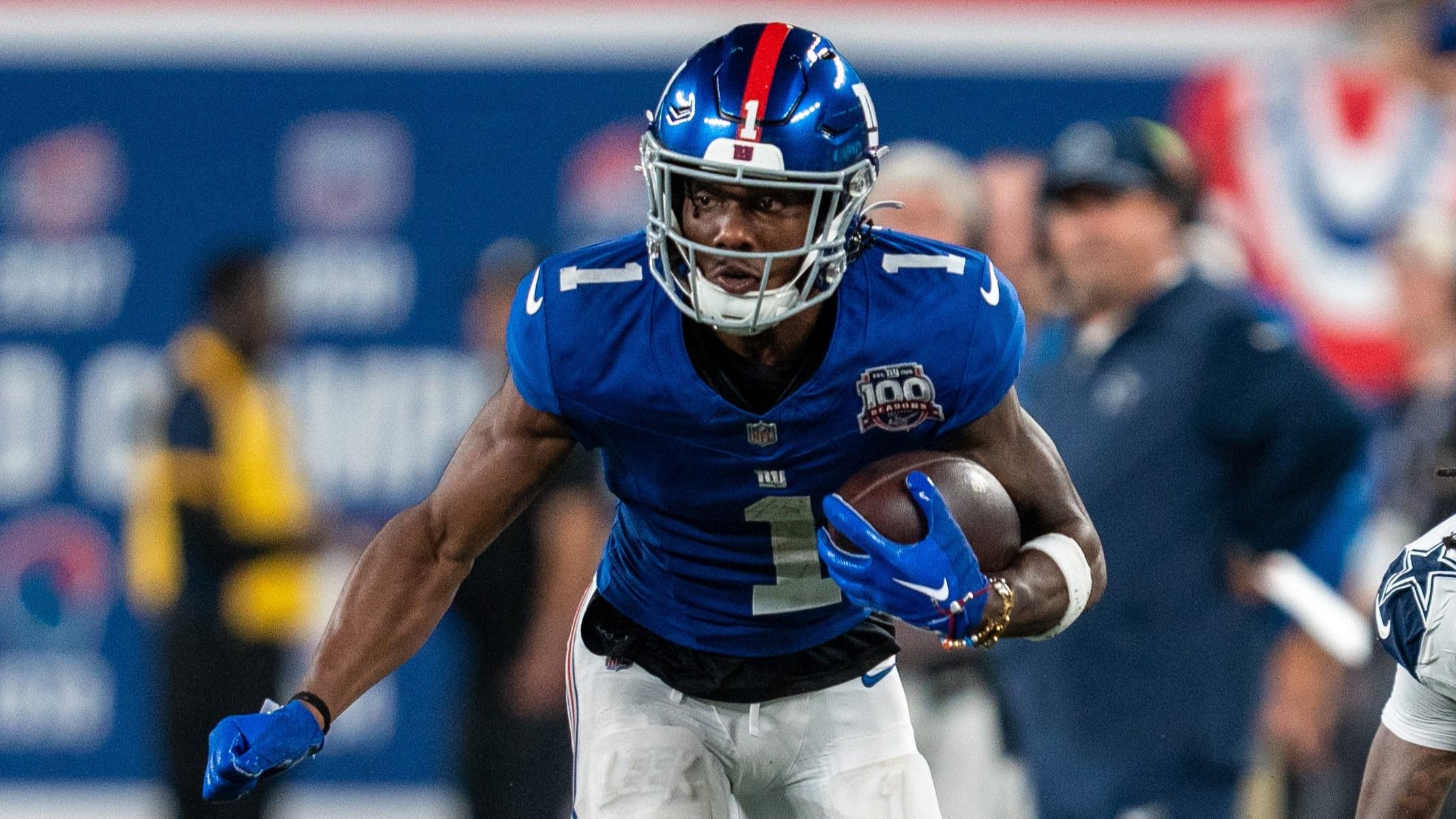 New York Giants wide receiver Malik Nabers (1) looks to run upfield after catching a pass at MetLife Stadium