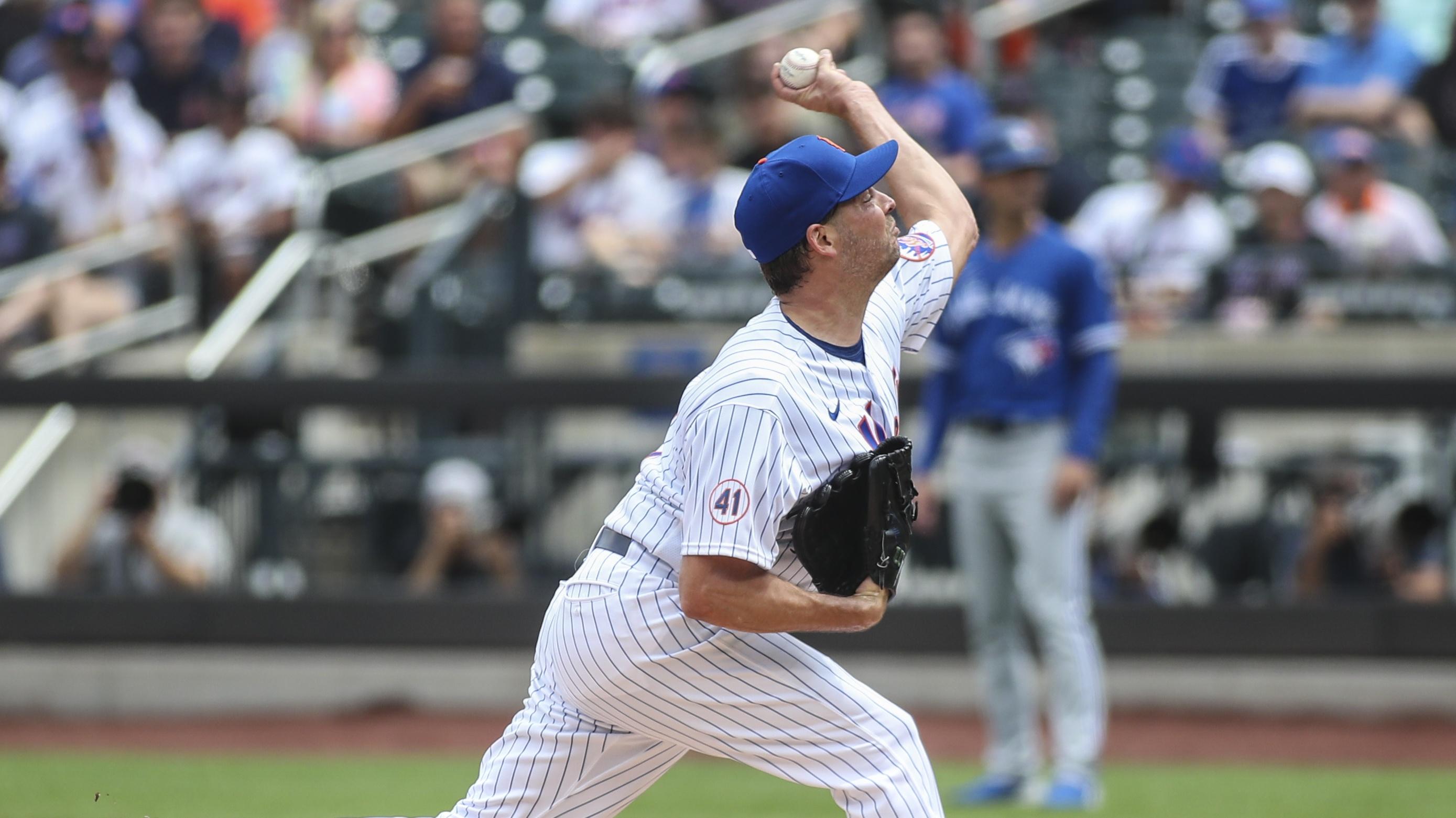 Jul 25, 2021; New York City, New York, USA; New York Mets pitcher Rich Hill (14) pitches in the first inning against the Toronto Blue Jays at Citi Field.