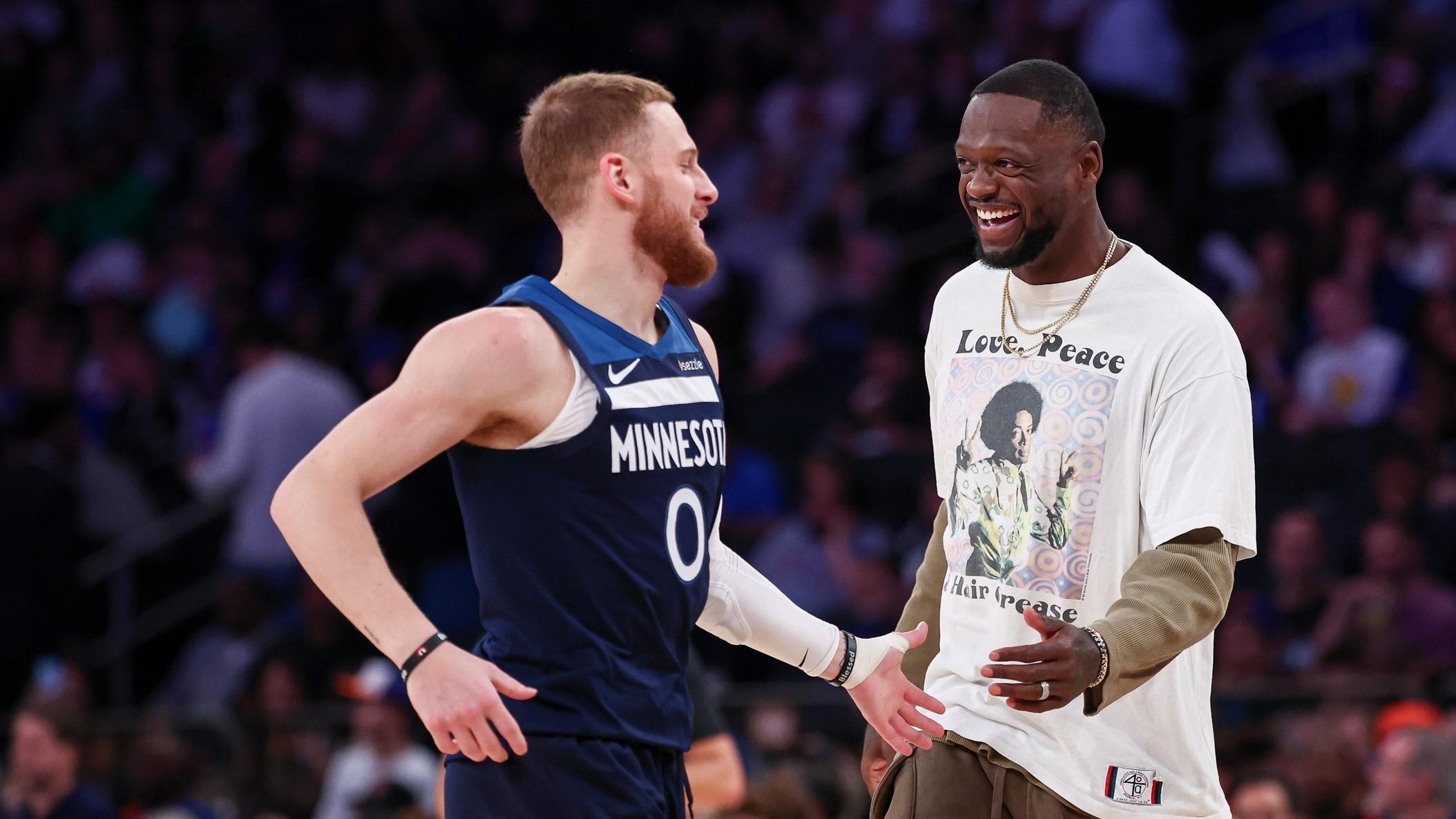 Minnesota Timberwolves guard Donte DiVincenzo (0) celebrates with forward Julius Randle (30) during the first half against the New York Knicks at Madison Square Garden.