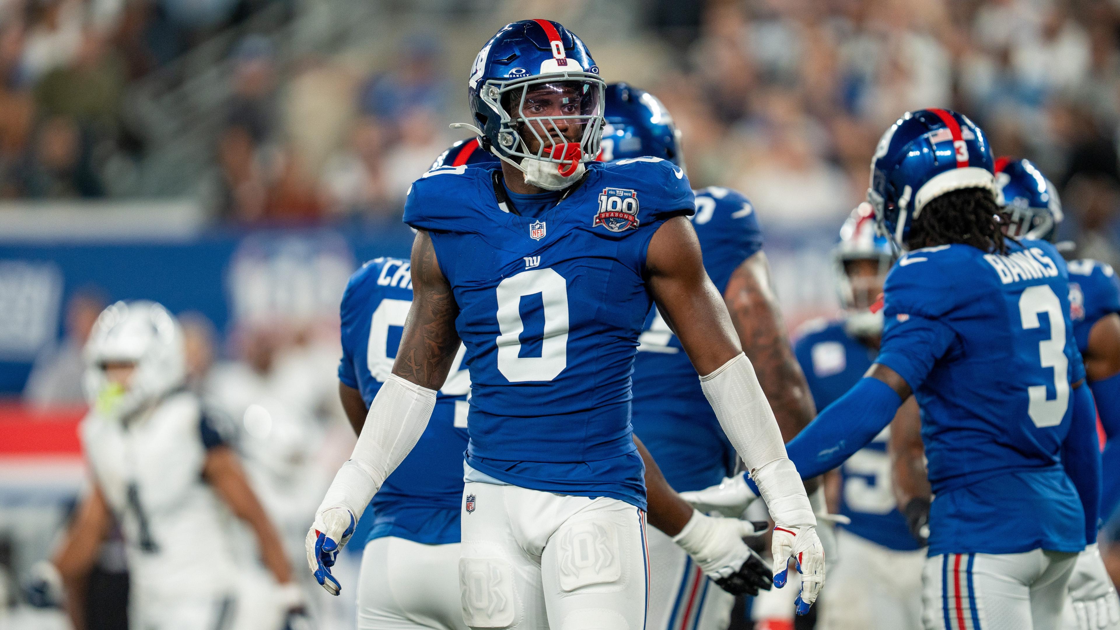  New York Giants linebacker Brian Burns (0) looks at his sideline for instructions at MetLife Stadium. 