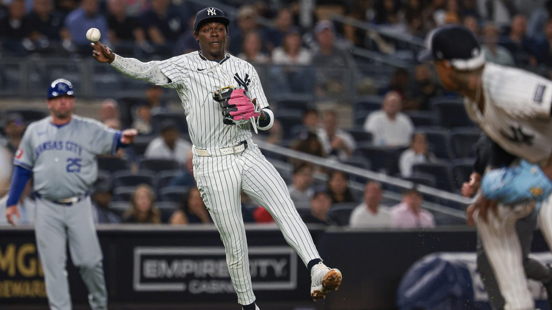 Sep 10, 2024; Bronx, New York, USA; New York Yankees third baseman Jazz Chisholm Jr. (13) throws the ball first base during the fifth inning against the Kansas City Royals at Yankee Stadium.