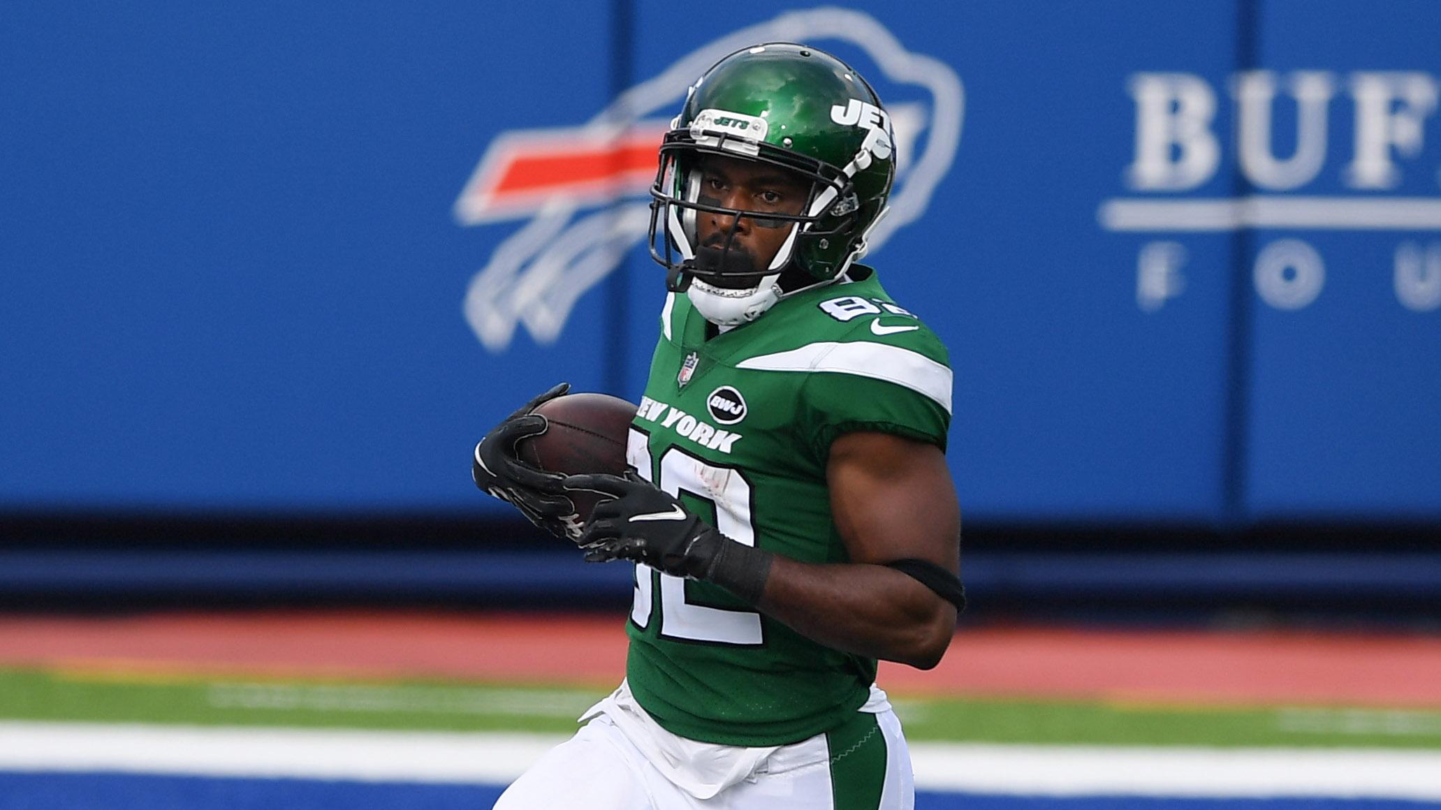 Sep 13, 2020; Orchard Park, New York, USA; New York Jets wide receiver Jamison Crowder (82) runs into the end zone for a touchdown in front of Buffalo Bills cornerback Taron Johnson (24) during the third quarter at Bills Stadium.