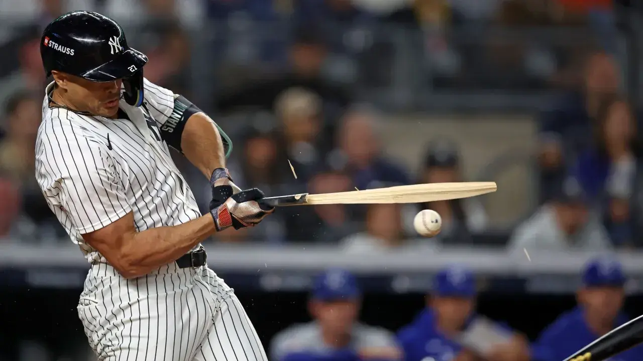 New York Yankees designated hitter Giancarlo Stanton (27) breaks a bat on a pitch against the Kansas City Royals in the first inning during game two of the ALDS for the 2024 MLB Playoffs at Yankee Stadium. / Vincent Carchietta-Imagn Images