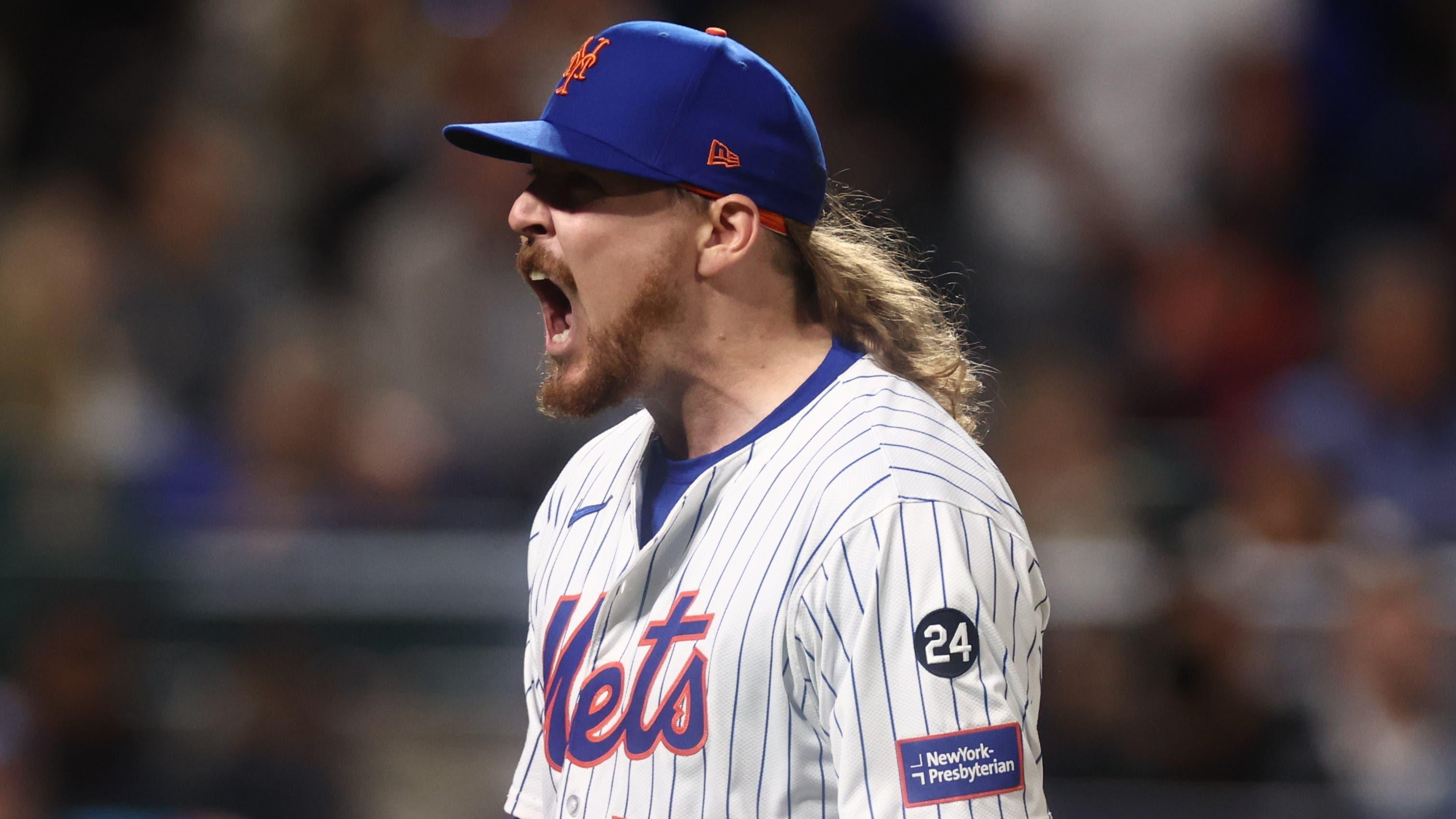 Oct 18, 2024; New York City, New York, USA; New York Mets pitcher Ryne Stanek (55) reacts after a strikeout to end the seventh inning against the Los Angeles Dodgers during game five of the NLCS for the 2024 MLB playoffs at Citi Field. Mandatory Credit: Vincent Carchietta-Imagn Images