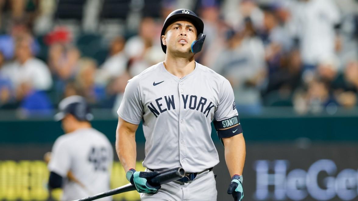 New York Yankees designated hitter Giancarlo Stanton (27) heads to the dugout after striking out during the fifth inning against the Texas Rangers at Globe Life Field.