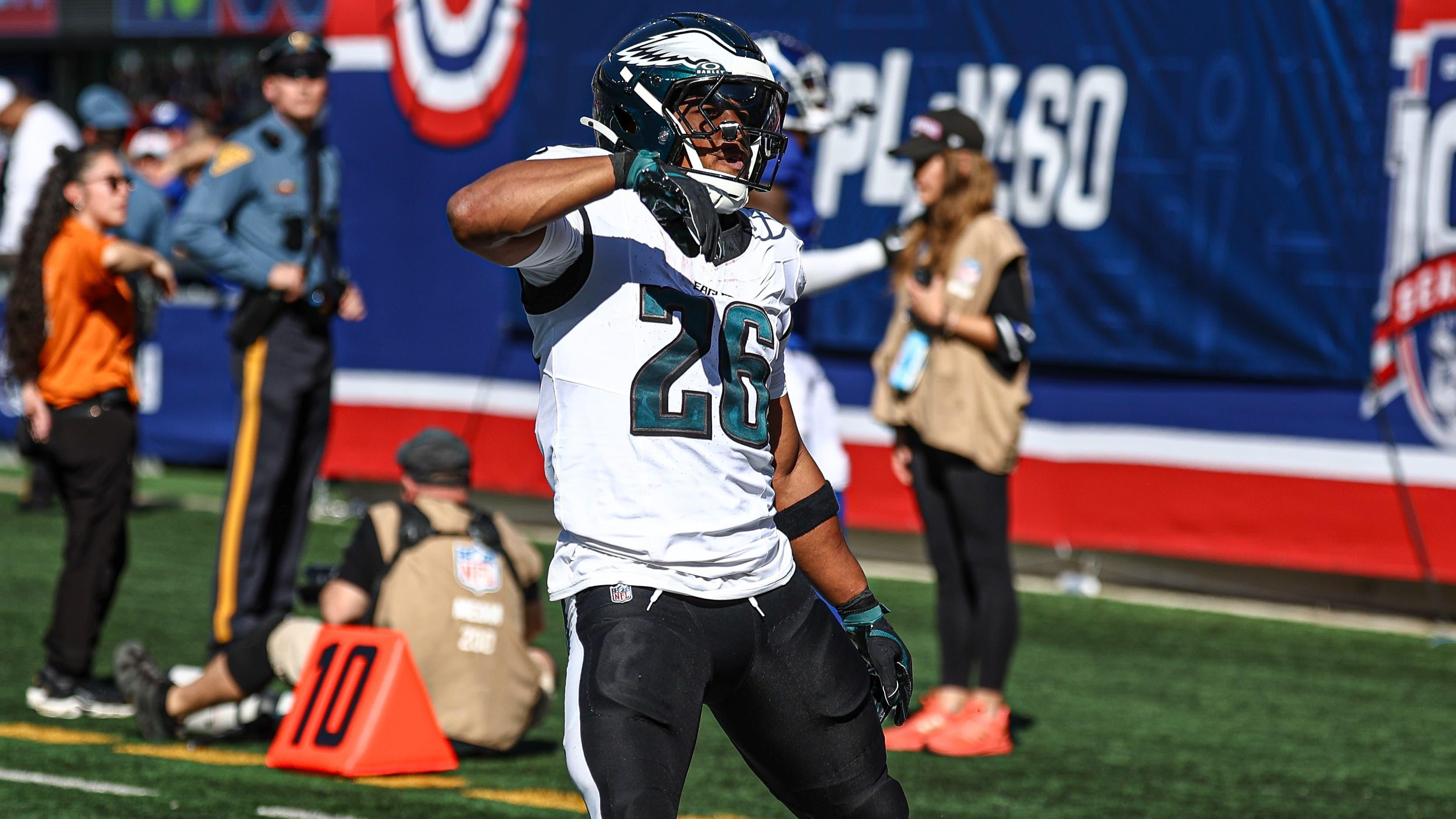 Philadelphia Eagles running back Saquon Barkley (26) celebrates after a long run during the first half against the New York Giants at MetLife Stadium