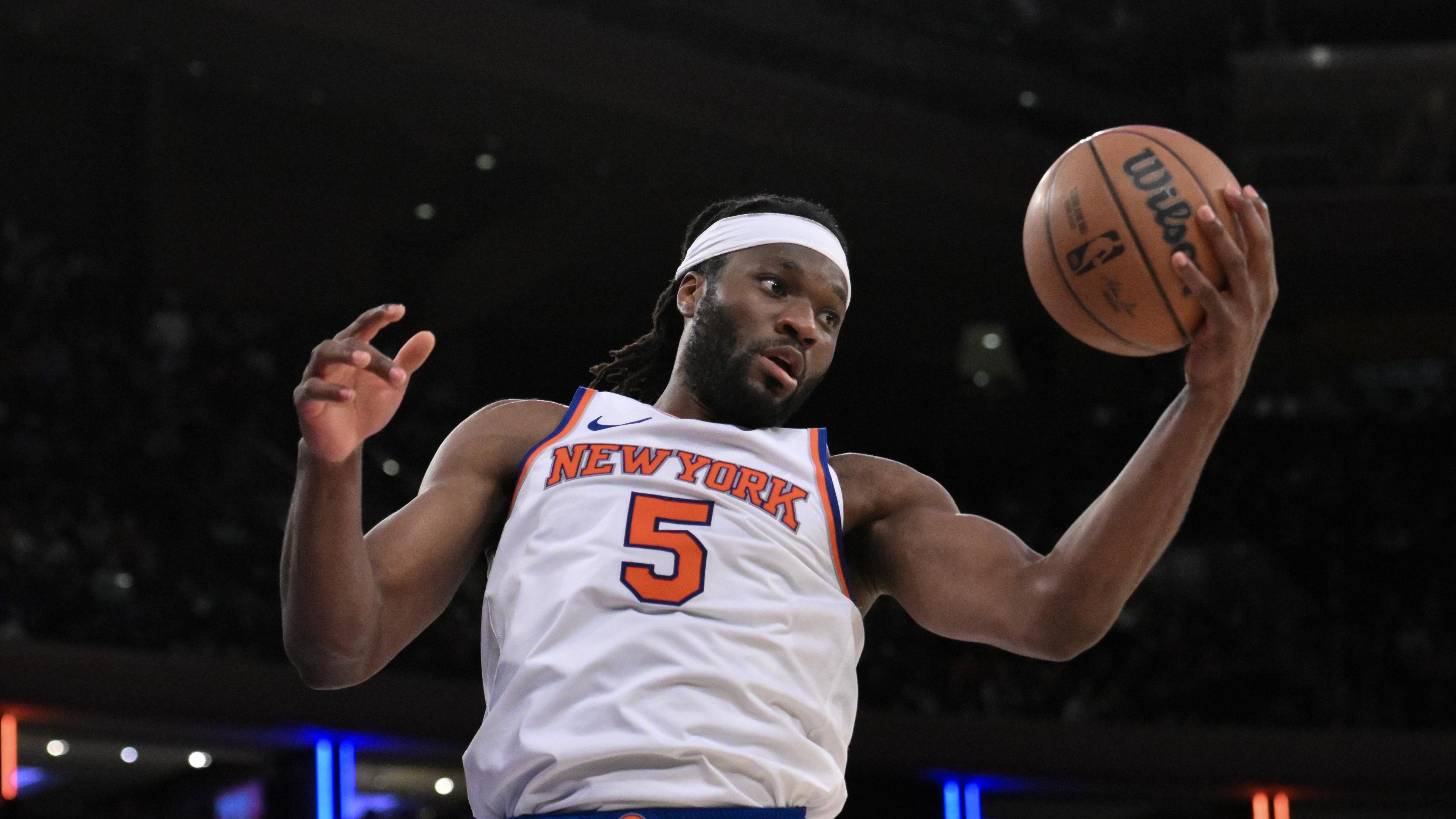 Oct 15, 2024; New York, New York, USA; New York Knicks forward Precious Achiuwa (5) grabs a rebound against the Charlotte Hornets during the second half at Madison Square Garden. Mandatory Credit: John Jones-Imagn Images