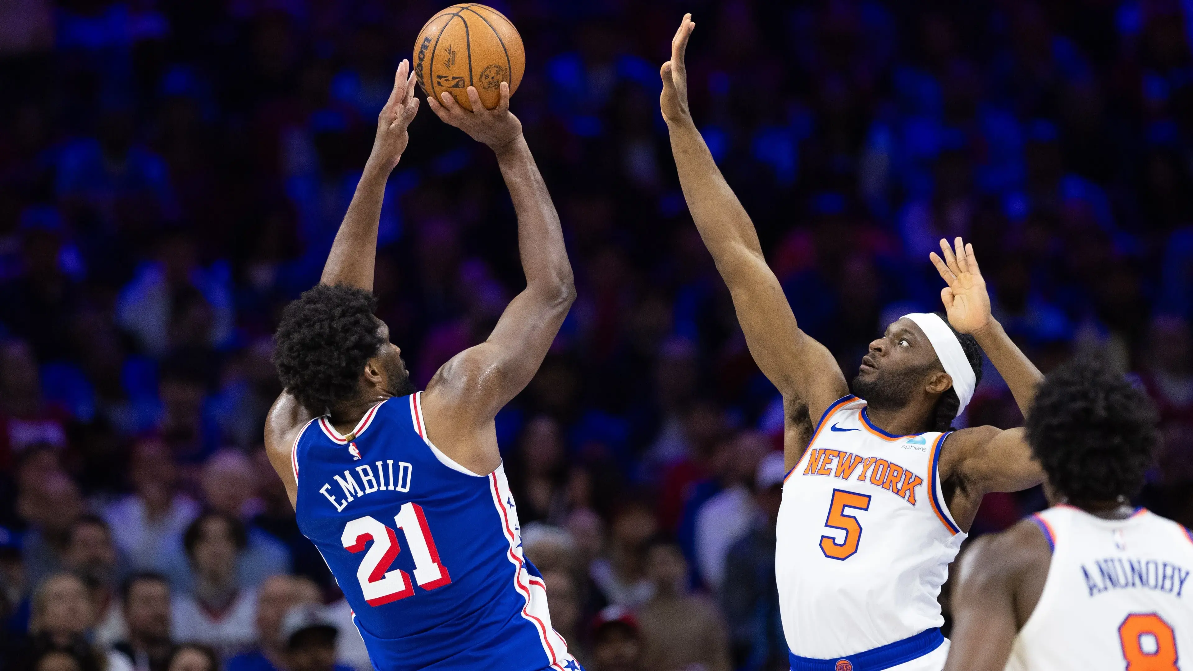 Apr 25, 2024; Philadelphia, Pennsylvania, USA; Philadelphia 76ers center Joel Embiid (21) shoots past New York Knicks forward Precious Achiuwa (5) during the first half of game three of the first round for the 2024 NBA playoffs at Wells Fargo Center. Mandatory Credit: Bill Streicher-USA TODAY Sports / © Bill Streicher-USA TODAY Sports