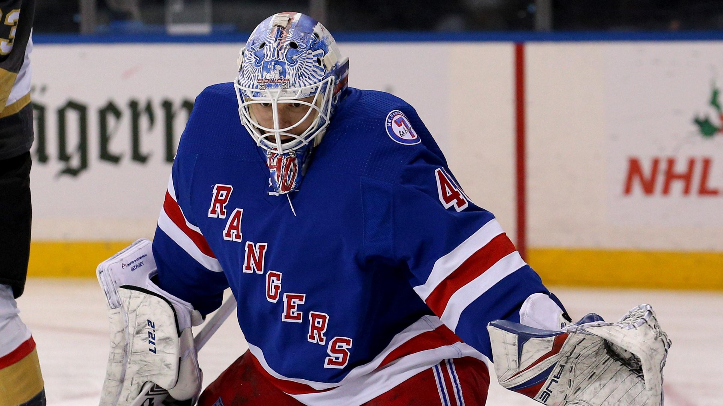 Dec 17, 2021; New York, New York, USA; New York Rangers goaltender Alexandar Georgiev (40) makes a save in front of Vegas Golden Knights right wing Evgenii Dadonov (63) during the first period at Madison Square Garden. Mandatory Credit: Brad Penner-USA TODAY Sports