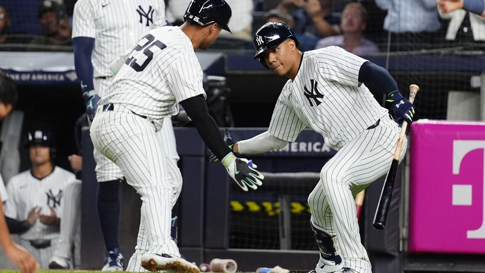 Sep 12, 2024; Bronx, New York, USA; New York Yankees right fielder Juan Soto (22) congratulated New York Yankees second baseman Gleyber Torres (25) for hitting a home run against the Boston Red Sox during the first inning at Yankee Stadium.