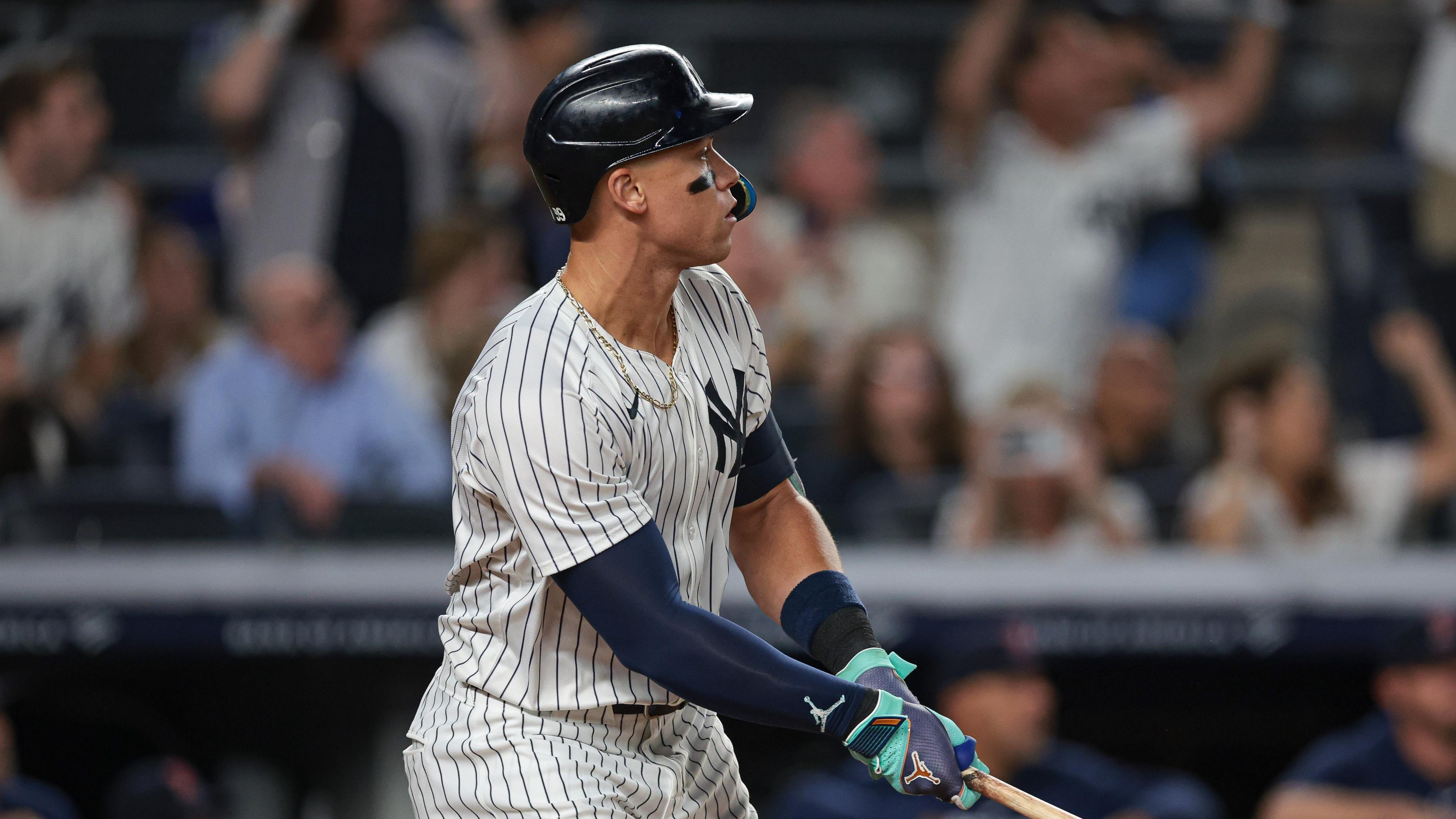 Sep 13, 2024; Bronx, New York, USA; New York Yankees center fielder Aaron Judge (99) looks up at his grand slam home run during the seventh inning against the Boston Red Sox at Yankee Stadium. Mandatory Credit: Vincent Carchietta-Imagn Images