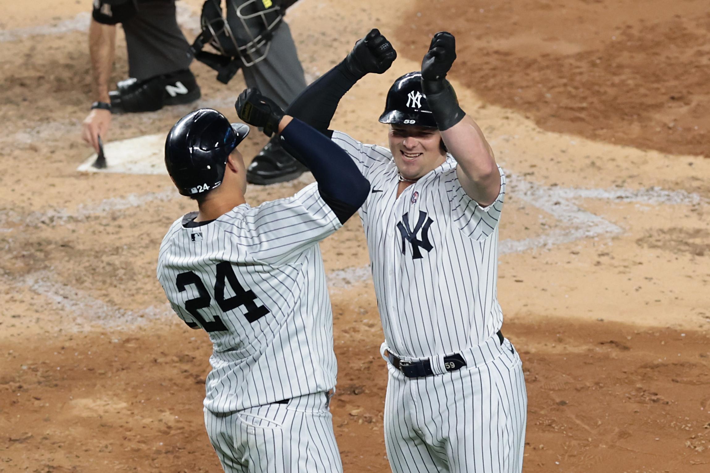 Sep 11, 2020; Bronx, New York, USA; New York Yankees first baseman Luke Voit (59) celebrates his second three run home run pf the game with catcher Gary Sanchez (24) during the fifth inning against the Baltimore Orioles at Yankee Stadium. Mandatory Credit: Vincent Carchietta-USA TODAY Sports