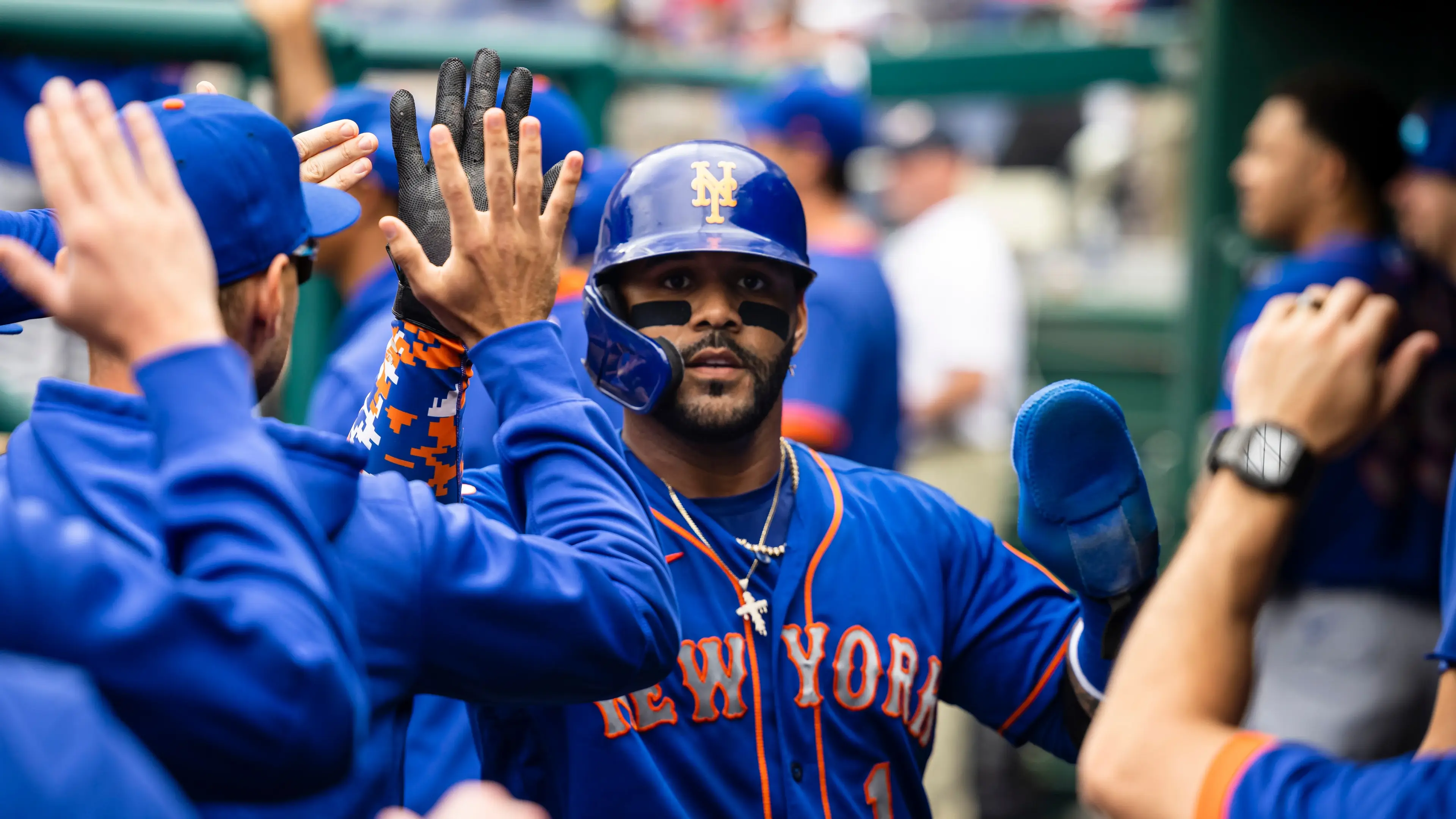 New York Mets third baseman Jonathan Villar (1) celebrates with teammates after scoring a run against the Washington Nationals at Nationals Park. / Scott Taetsch - USA TODAY Sports