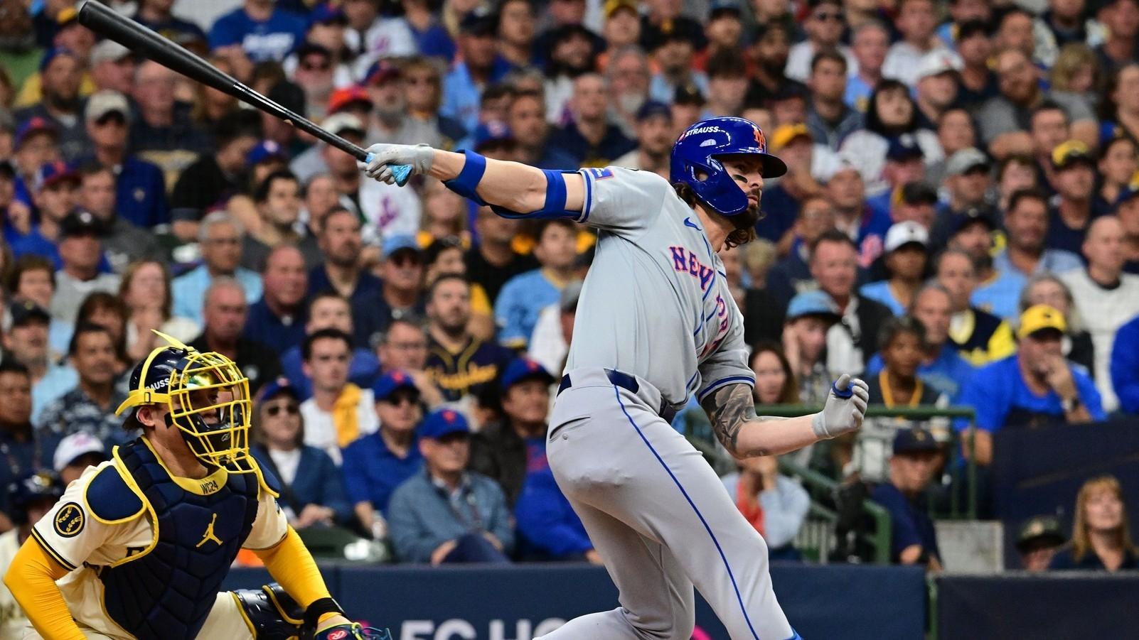 New York Mets outfielder Jesse Winker (3) hits a two run triple against the Milwaukee Brewers during the second inning in game one of the Wildcard round for the 2024 MLB Playoffs at American Family Field.