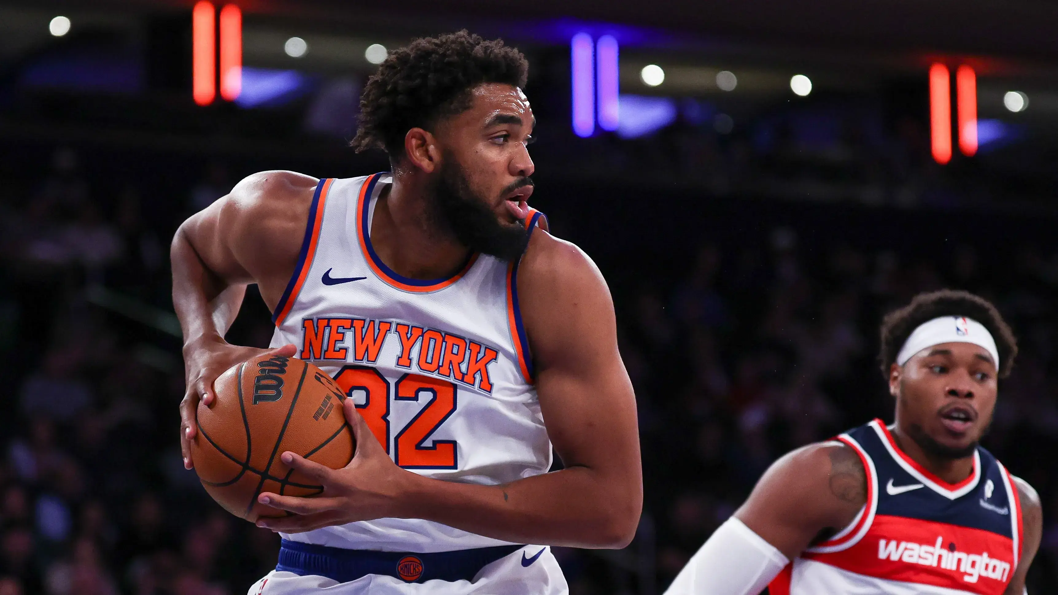 New York, New York, USA; New York Knicks center Karl-Anthony Towns (32) secures a rebound in front of Washington Wizards guard Bilal Coulibaly (0) during the first half at Madison Square Garden. / Vincent Carchietta - Imagn Images