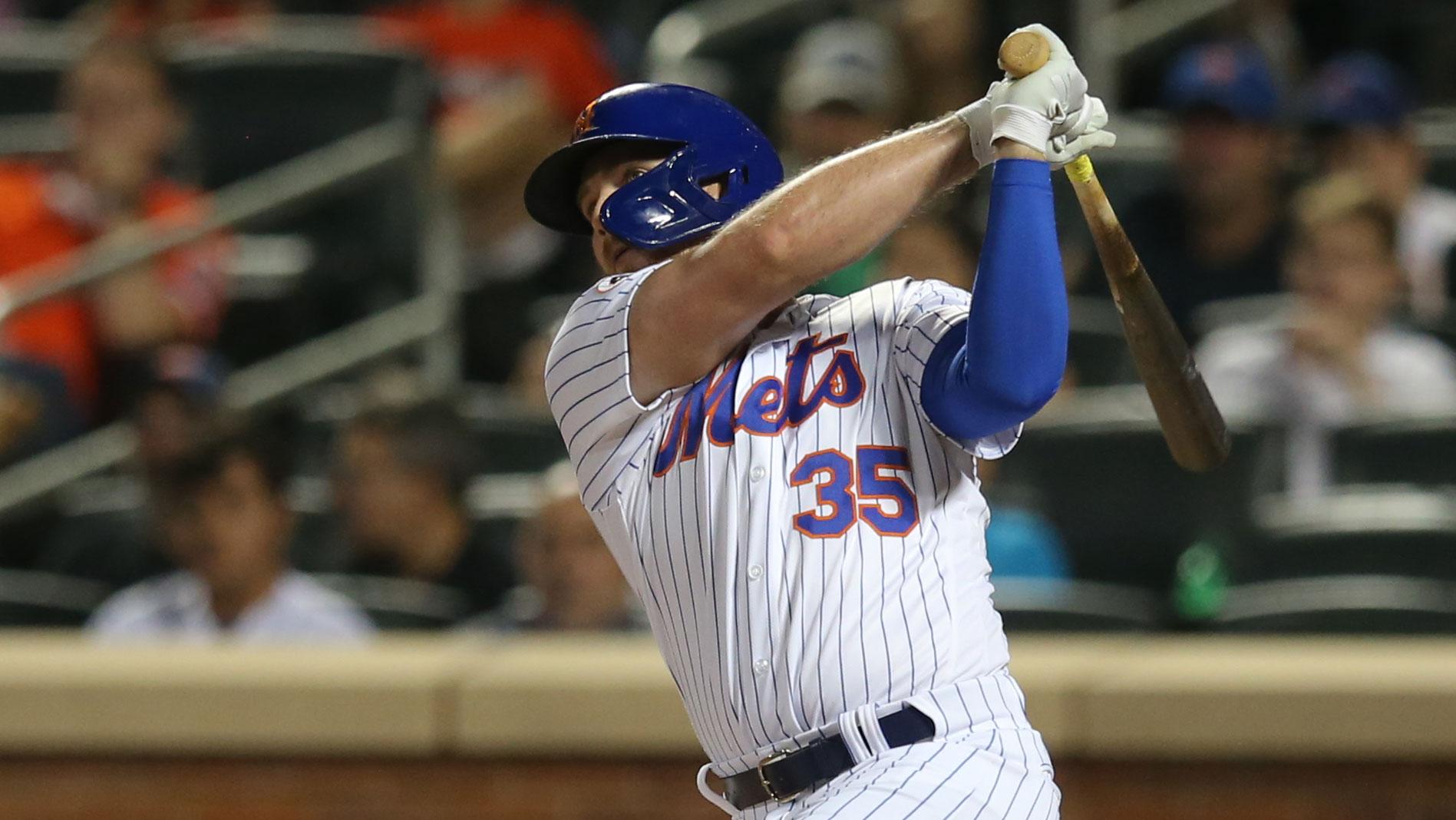 Jul 28, 2021; New York City, New York, USA; New York Mets pinch hitter Brandon Drury (35) hits a solo home run against the Atlanta Braves during the seventh inning at Citi Field.