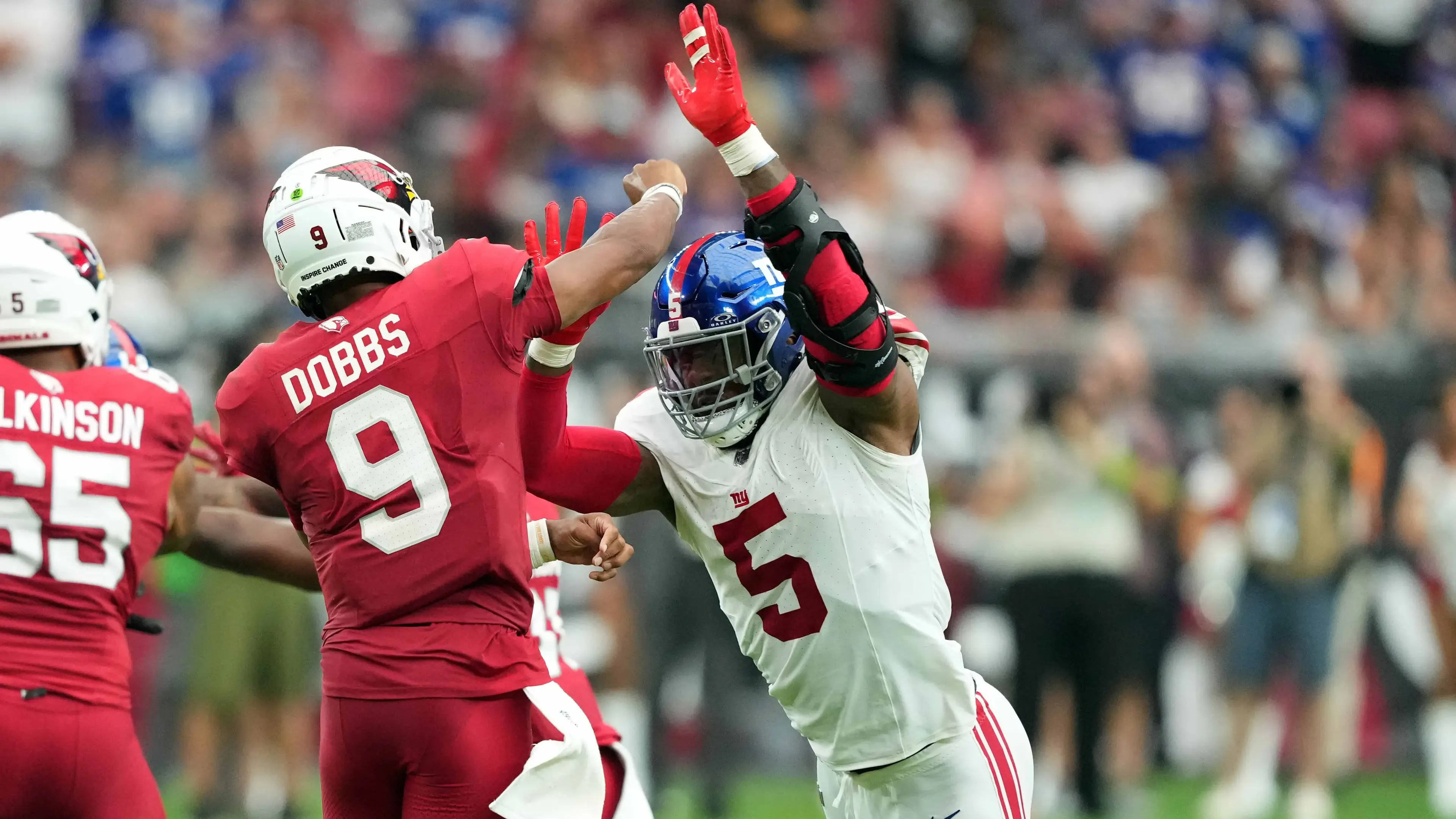 Sep 17, 2023; Glendale, Arizona, USA; Arizona Cardinals quarterback Joshua Dobbs (9) is pressured by New York Giants linebacker Kayvon Thibodeaux (5) as he throws during the second half at State Farm Stadium. / Joe Camporeale-USA TODAY Sports