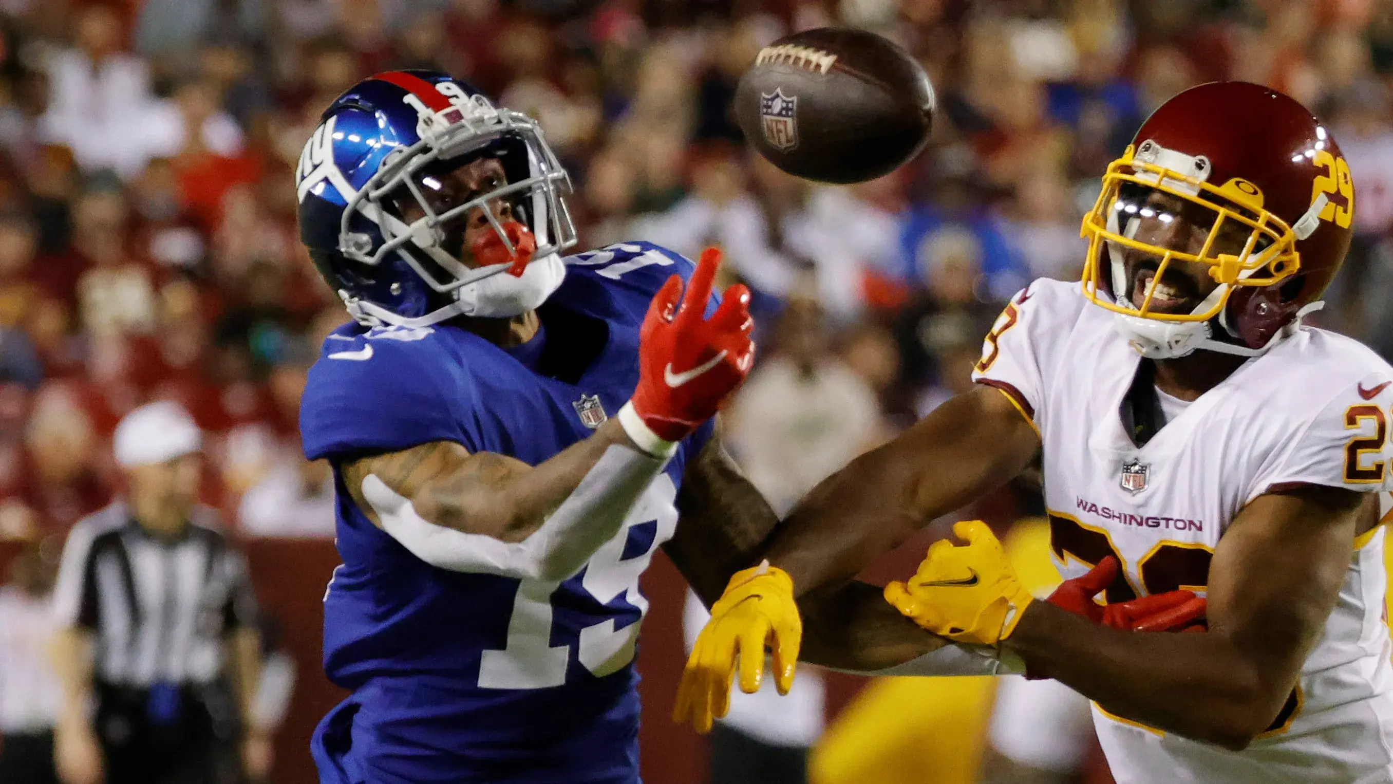 Sep 16, 2021; Landover, Maryland, USA; New York Giants wide receiver Kenny Golladay (19) attempts to make a catch as Washington Football Team cornerback Kendall Fuller (29) defends in the third quarter at FedExField. Mandatory Credit: Geoff Burke-USA TODAY Sports / Geoff Burke-USA TODAY Sports