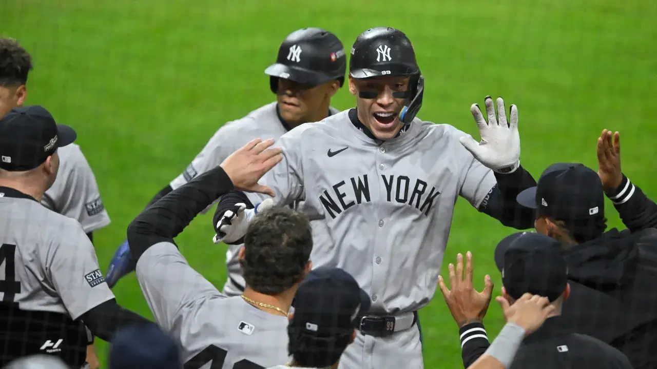 New York Yankees outfielder Aaron Judge (99) celebrates hitting a two-run home run with teammates during the eighth inning against the Cleveland Guardians in game 3 of the American League Championship Series at Progressive Field. / David Richard-Imagn Images