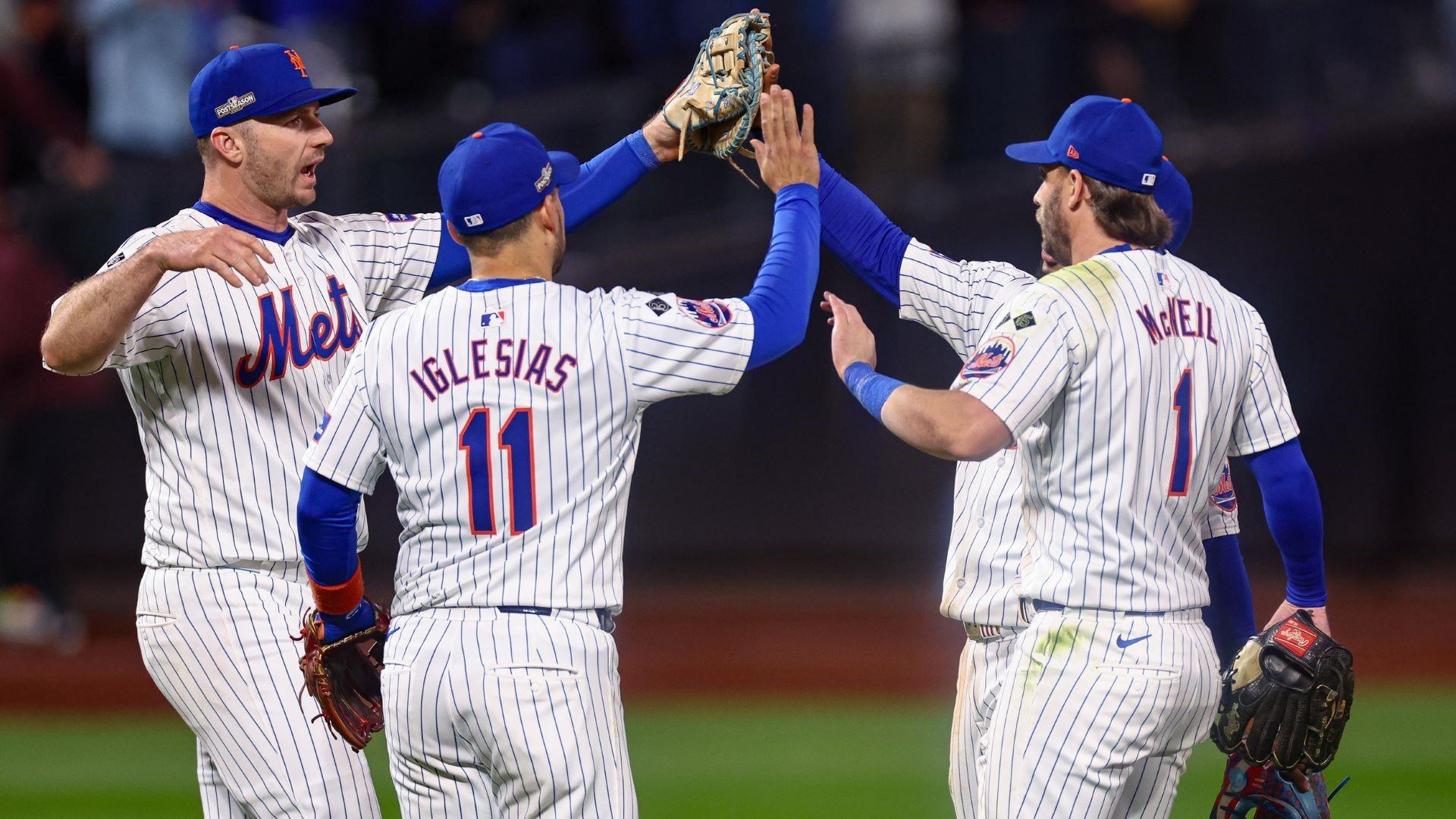 Oct 18, 2024; New York City, New York, USA; New York Mets first baseman Pete Alonso (20) and second baseman Jose Iglesias (11) and second baseman Jeff McNeil (1) and right fielder Tyrone Taylor (15) celebrates after the Mets defatted the Los Angeles Dodgers in game five of the NLCS for the 2024 MLB playoffs at Citi Field. 