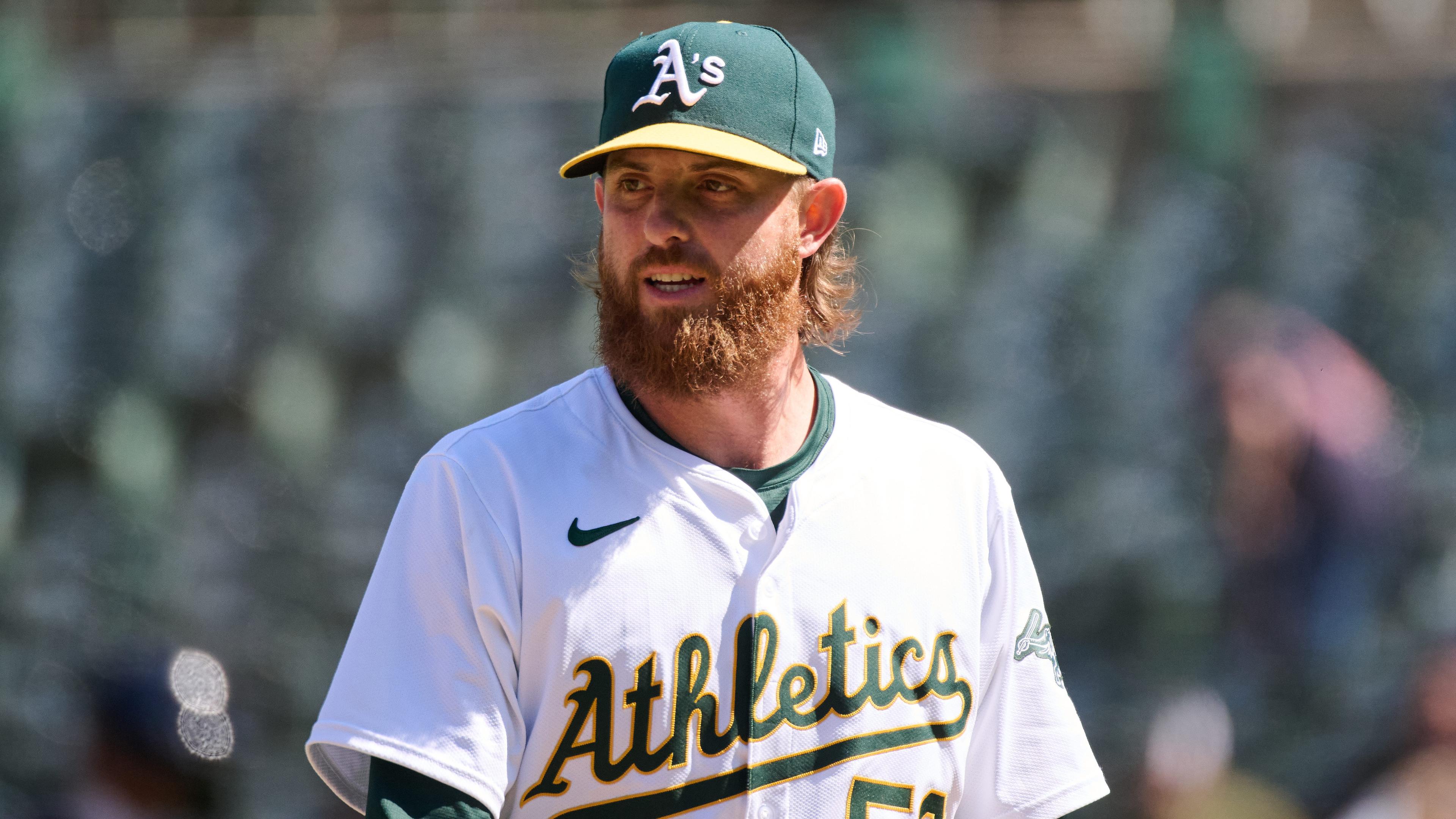 Oakland Athletics pitcher Paul Blackburn (58) walks to the dugout against the Cleveland Guardians after the seventh inning at Oakland-Alameda County Coliseum. 