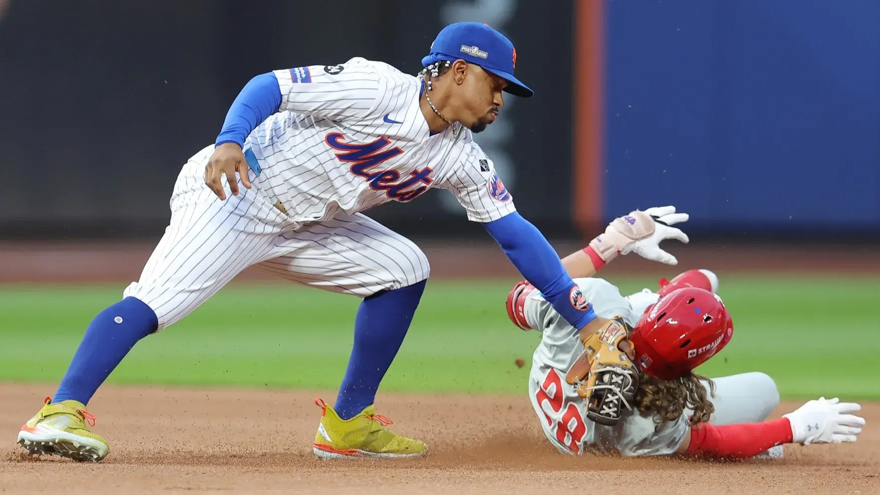 Oct 8, 2024; New York City, New York, USA; New York Mets shortstop Francisco Lindor (12) tags out Philadelphia Phillies third baseman Alec Bohm (28) at second base in the fourth inning during game three of the NLDS for the 2024 MLB Playoffs at Citi Field. / Brad Penner-Imagn Images