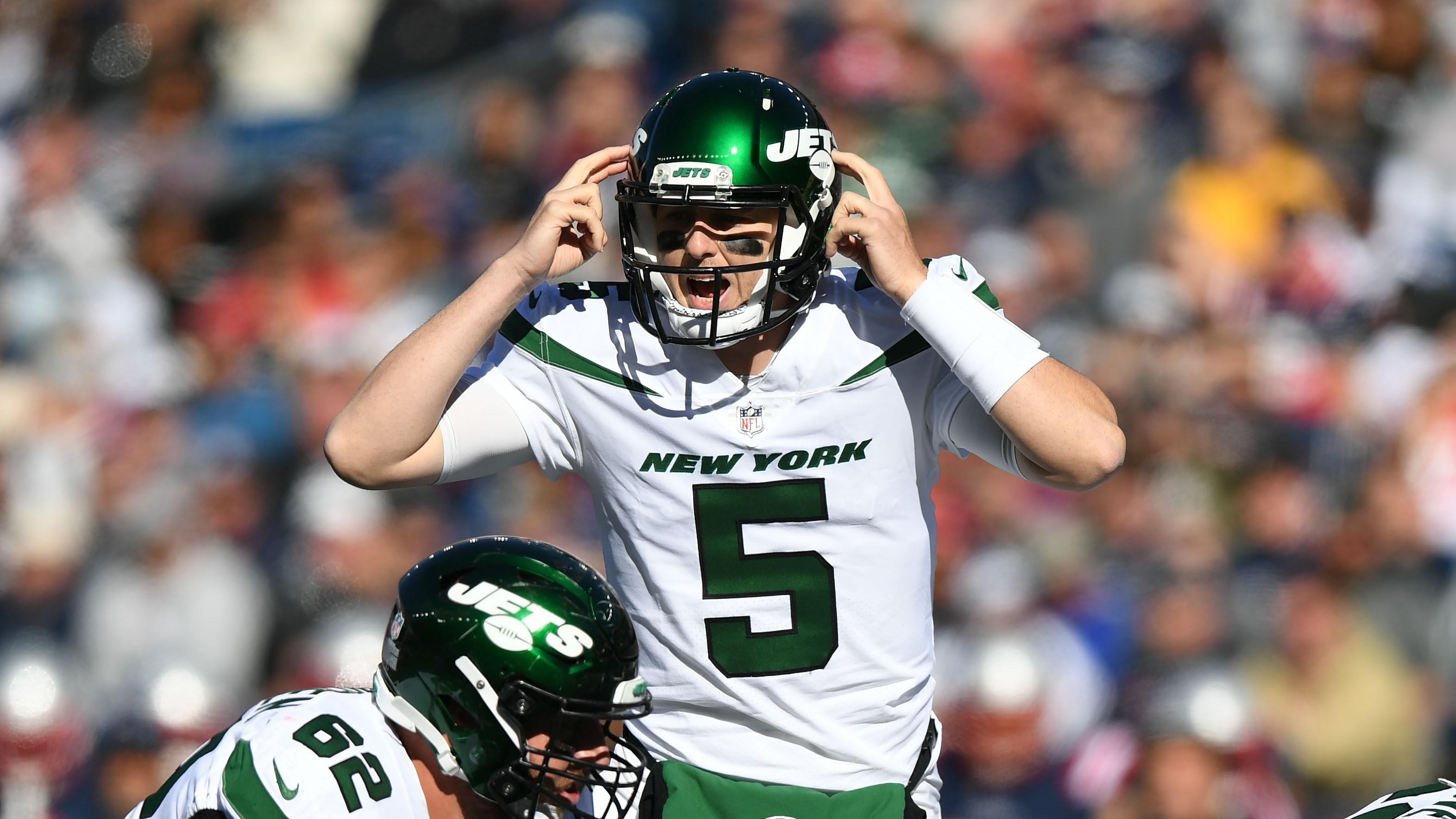 Oct 24, 2021; Foxborough, Massachusetts, USA; New York Jets quarterback Mike White (5) calls a play against the New England Patriots during the first half at Gillette Stadium.