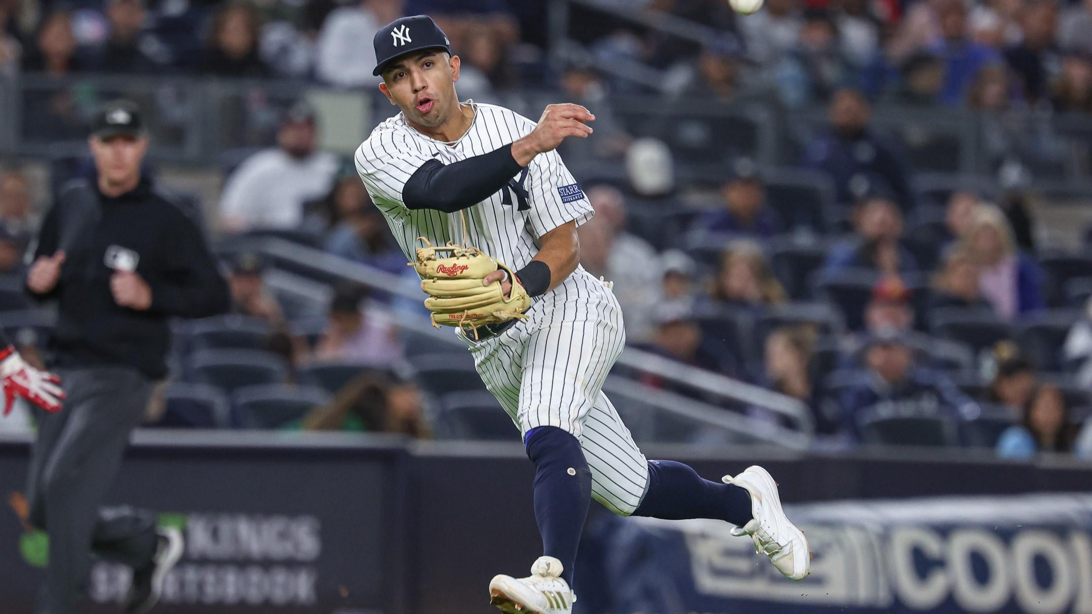 Sep 22, 2023; Bronx, New York, USA; New York Yankees third baseman Oswald Peraza (91) throws the ball to first base for an out during the sixth inning against the Arizona Diamondbacks at Yankee Stadium.