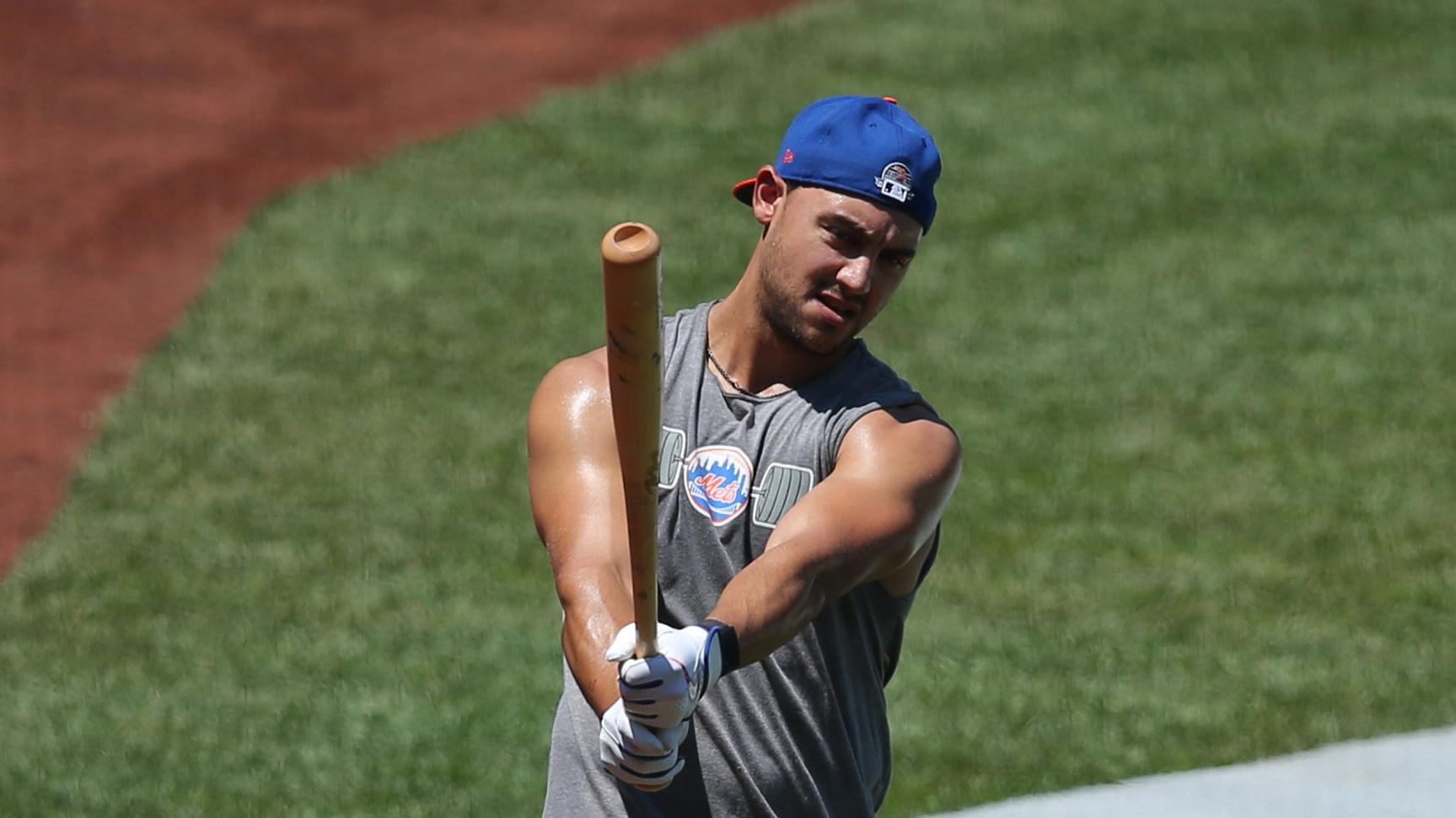 Jul 9, 2020; Flushing Meadows, New York, United States; New York Mets right fielder Michael Conforto (30) swings a bat outside the batting cage during batting practice during summer camp workouts at Citi Field.