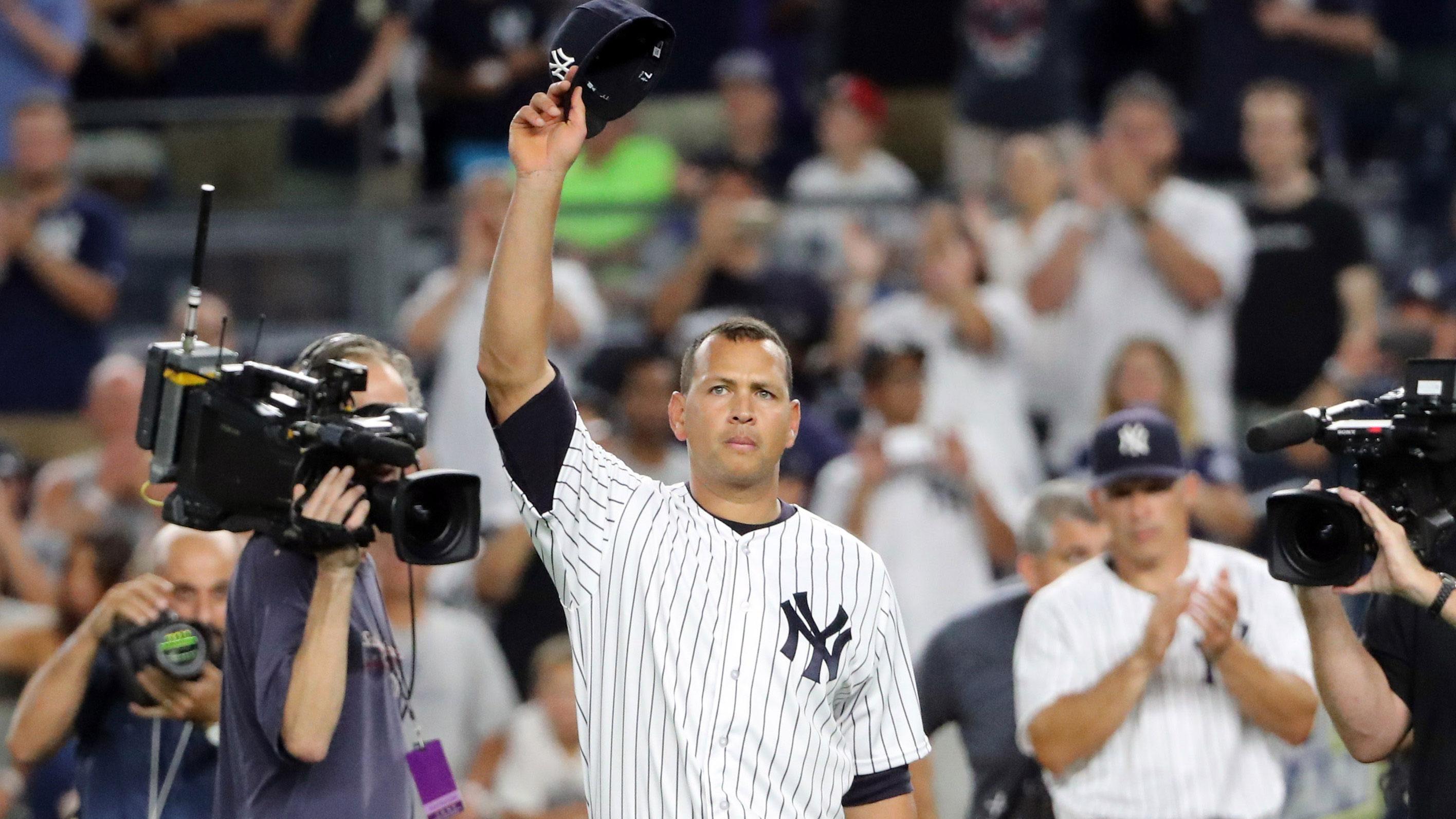 Aug 12, 2016; Bronx, NY, USA; New York Yankees designated hitter Alex Rodriguez (13) tips his cap in a farewell gesture to the fans after the game against the Tampa Bay Rays at Yankee Stadium. New York Yankees won 6-3.