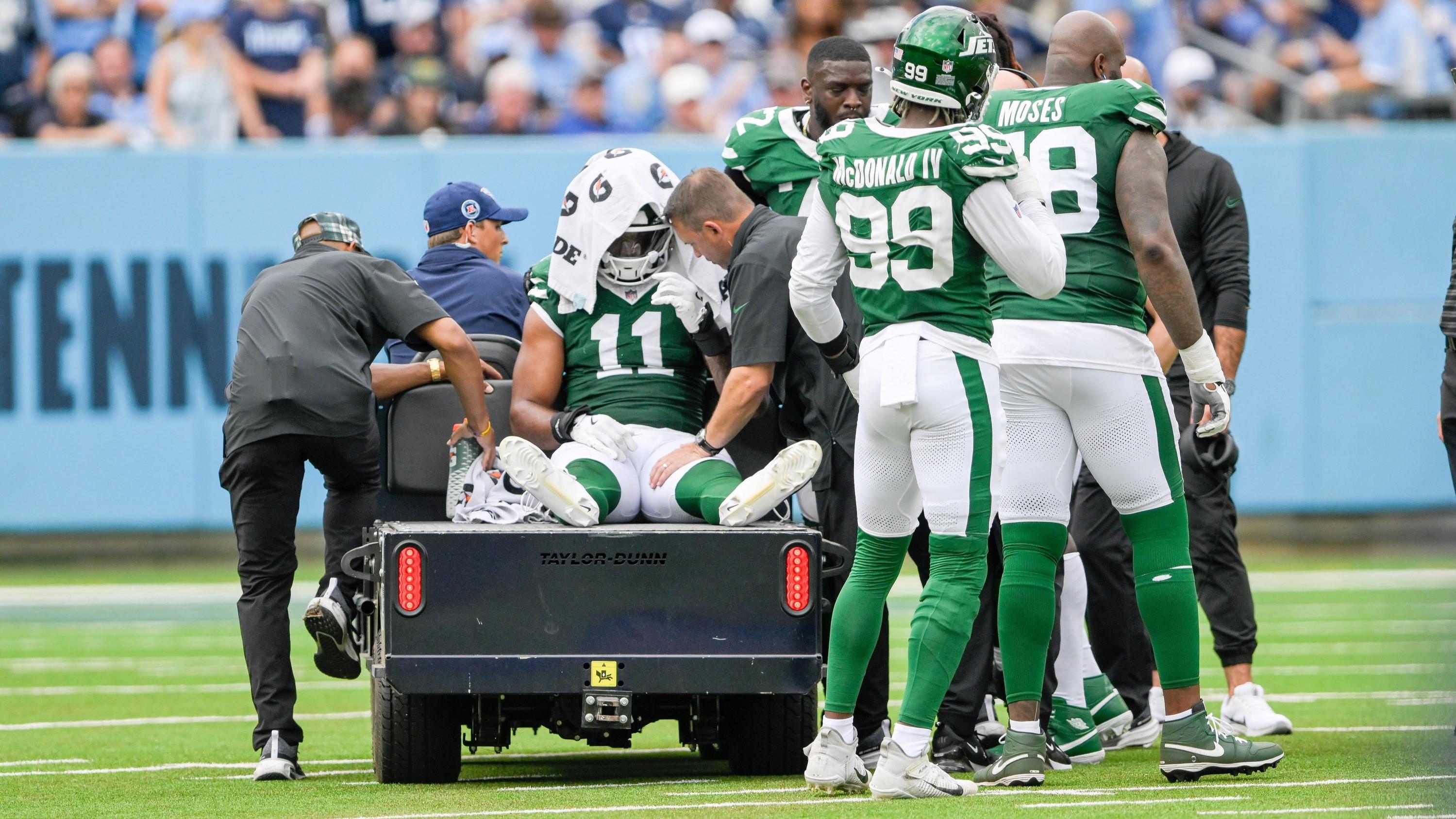 Sep 15, 2024; Nashville, Tennessee, USA; New York Jets linebacker Jermaine Johnson (11) is carted off against the Tennessee Titans during the second half at Nissan Stadium. 