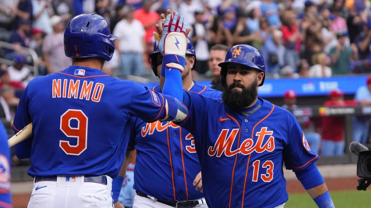 New York Mets center fielder Brandon Nimmo (9) congratulates New York Mets shortstop Luis Guillorme (13) for hitting a two run home run against the St. Louis Cardinals.