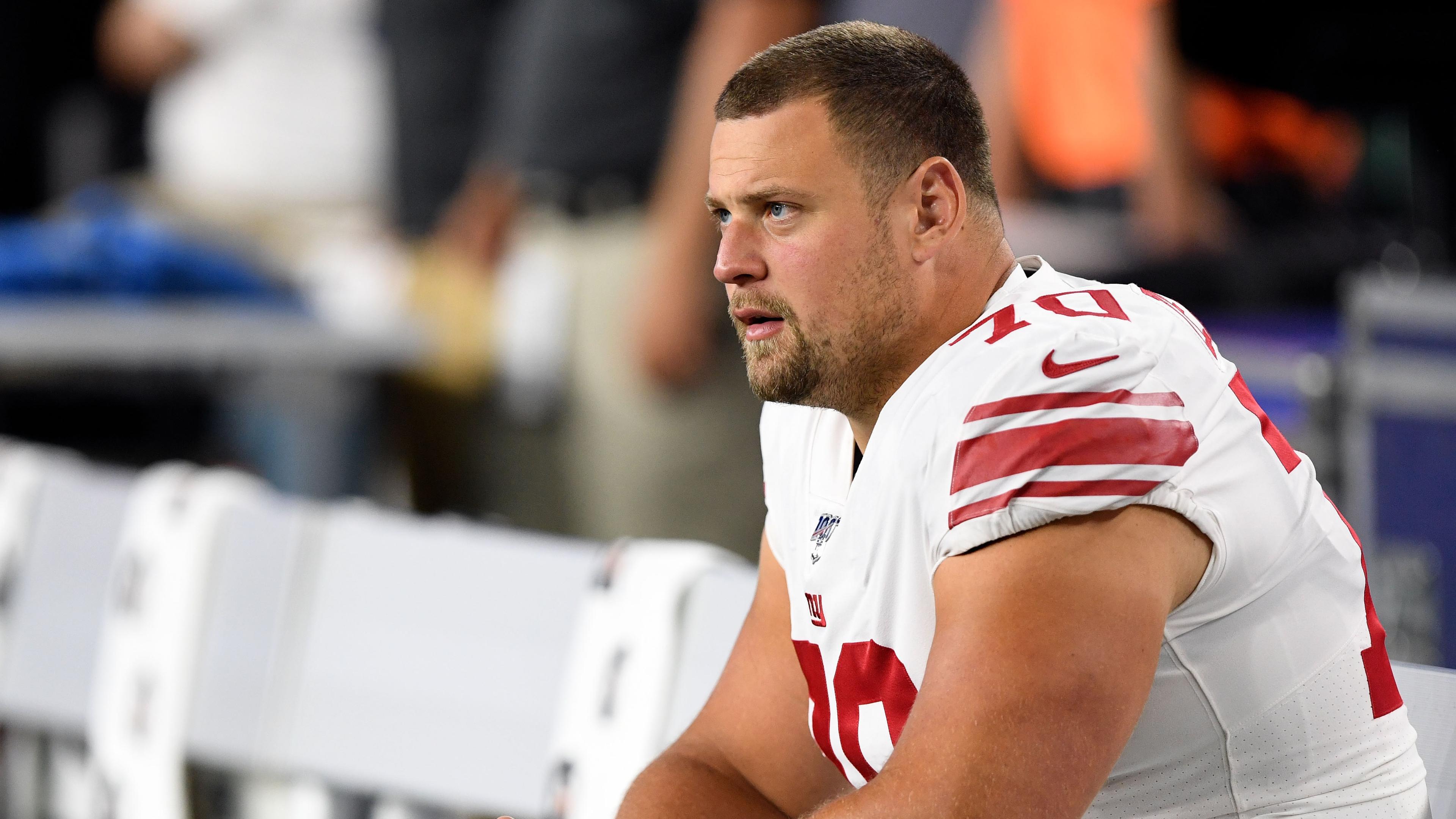 New York Giants offensive guard Kevin Zeitler (70) watches the game during the second half against the New England Patriots at Gillette Stadium.