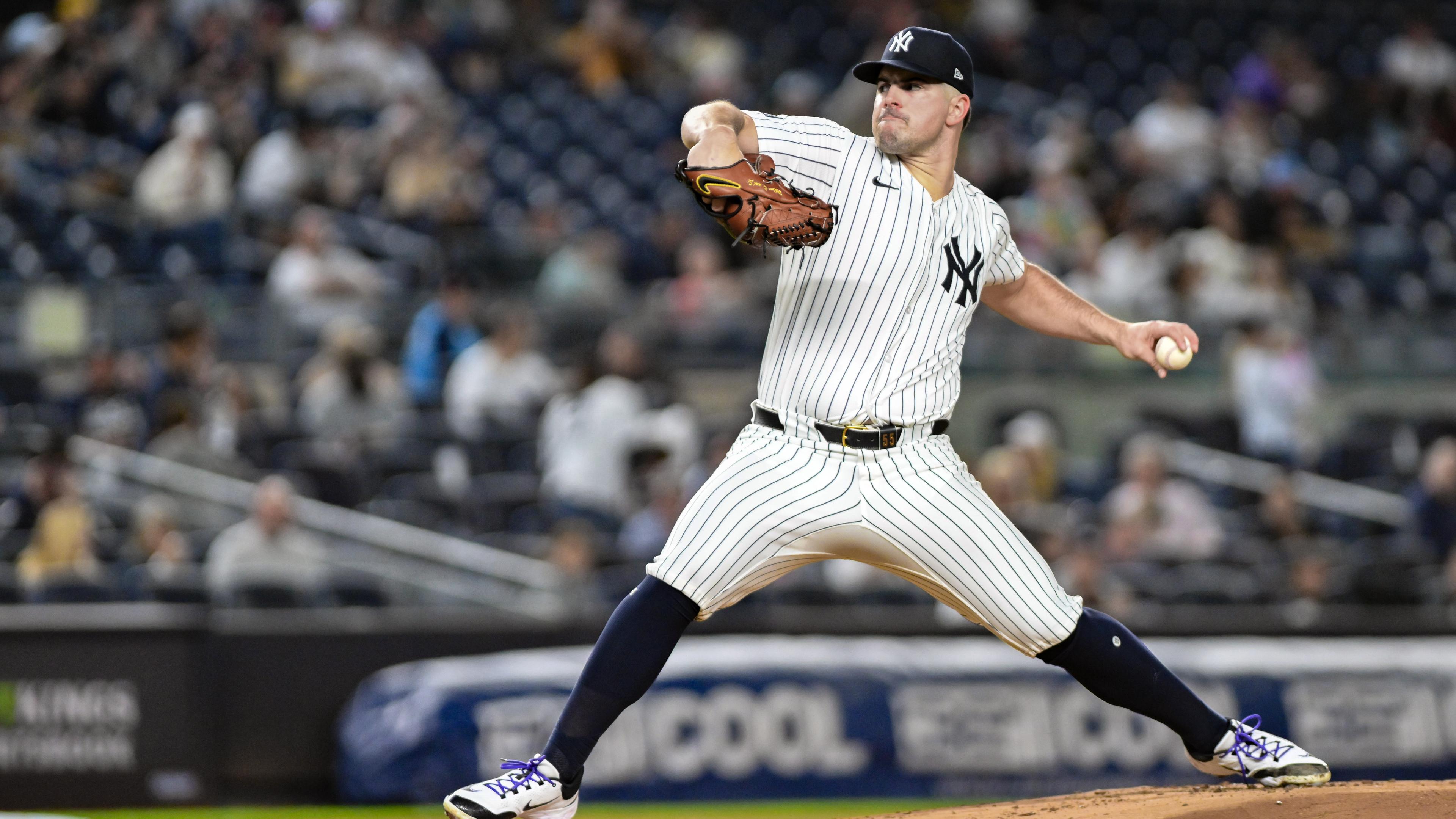 New York Yankees pitcher Carlos Rodon (55) pitches against the Pittsburgh Pirates during the first inning at Yankee Stadium.