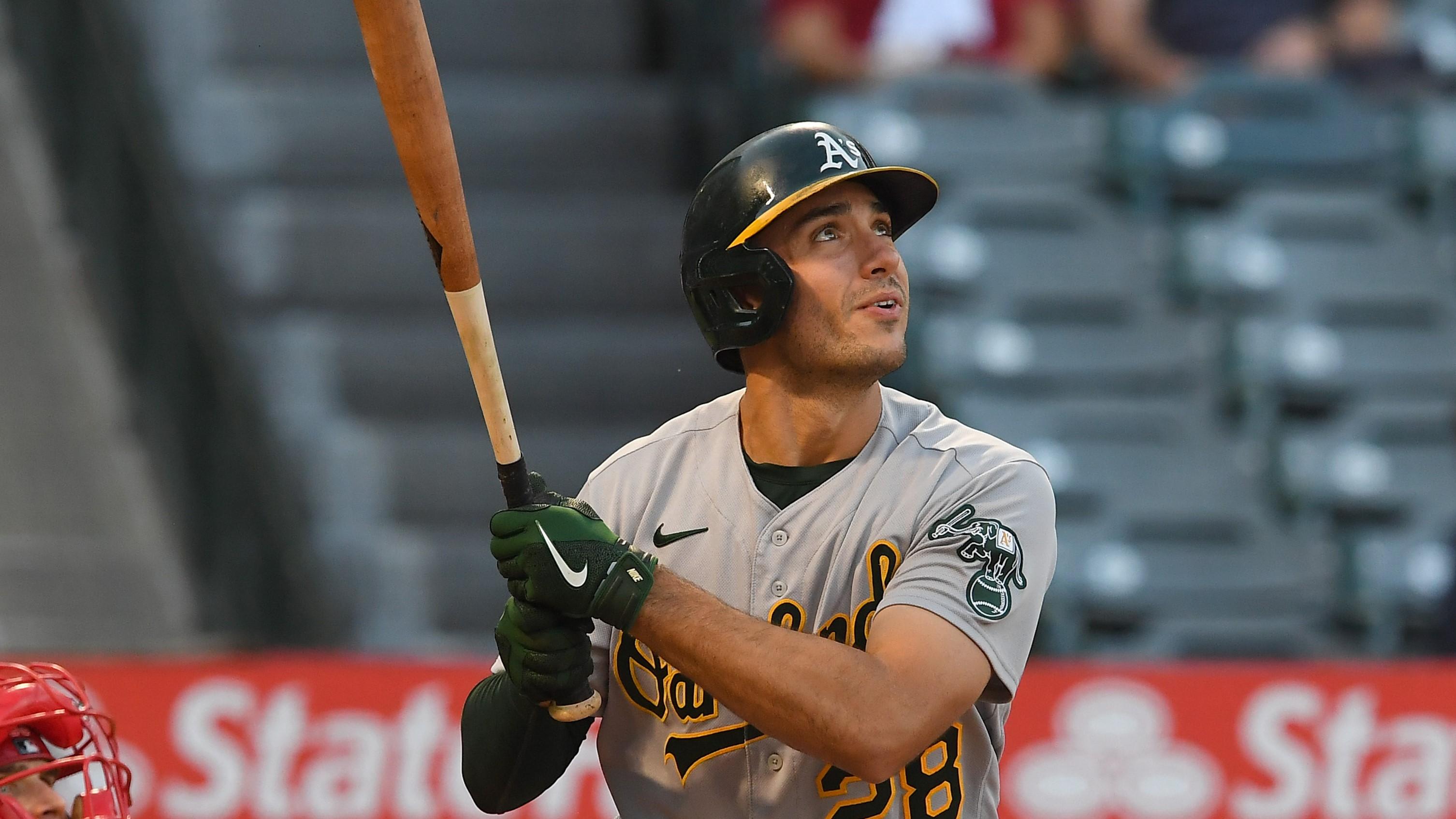 Oakland Athletics first baseman Matt Olson (28) hits a solo home run against the Los Angeles Angels in the first inning at Angel Stadium.