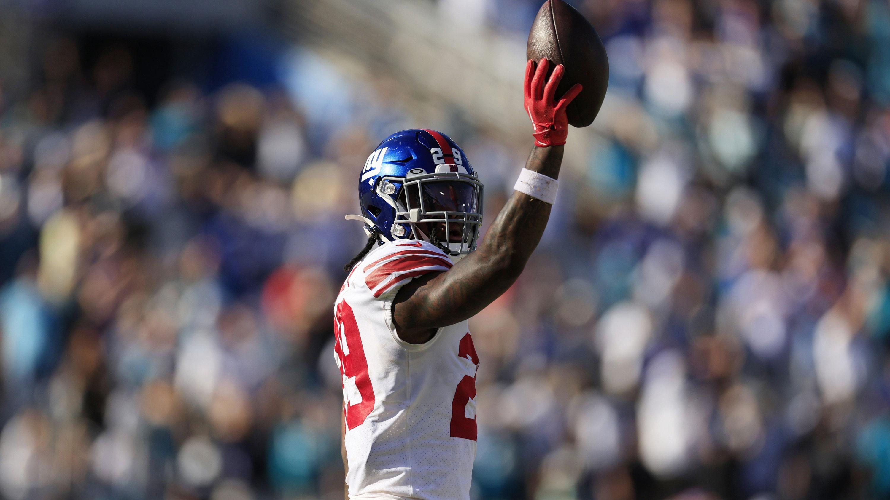 New York Giants safety Xavier McKinney (29) holds up at the ball at the end of the game of a regular season NFL football matchup Sunday, Oct. 23, 2022 at TIAA Bank Field in Jacksonville. The New York Giants defeated the Jacksonville Jaguars 23-17. [Corey Perrine/Florida Times-Union]