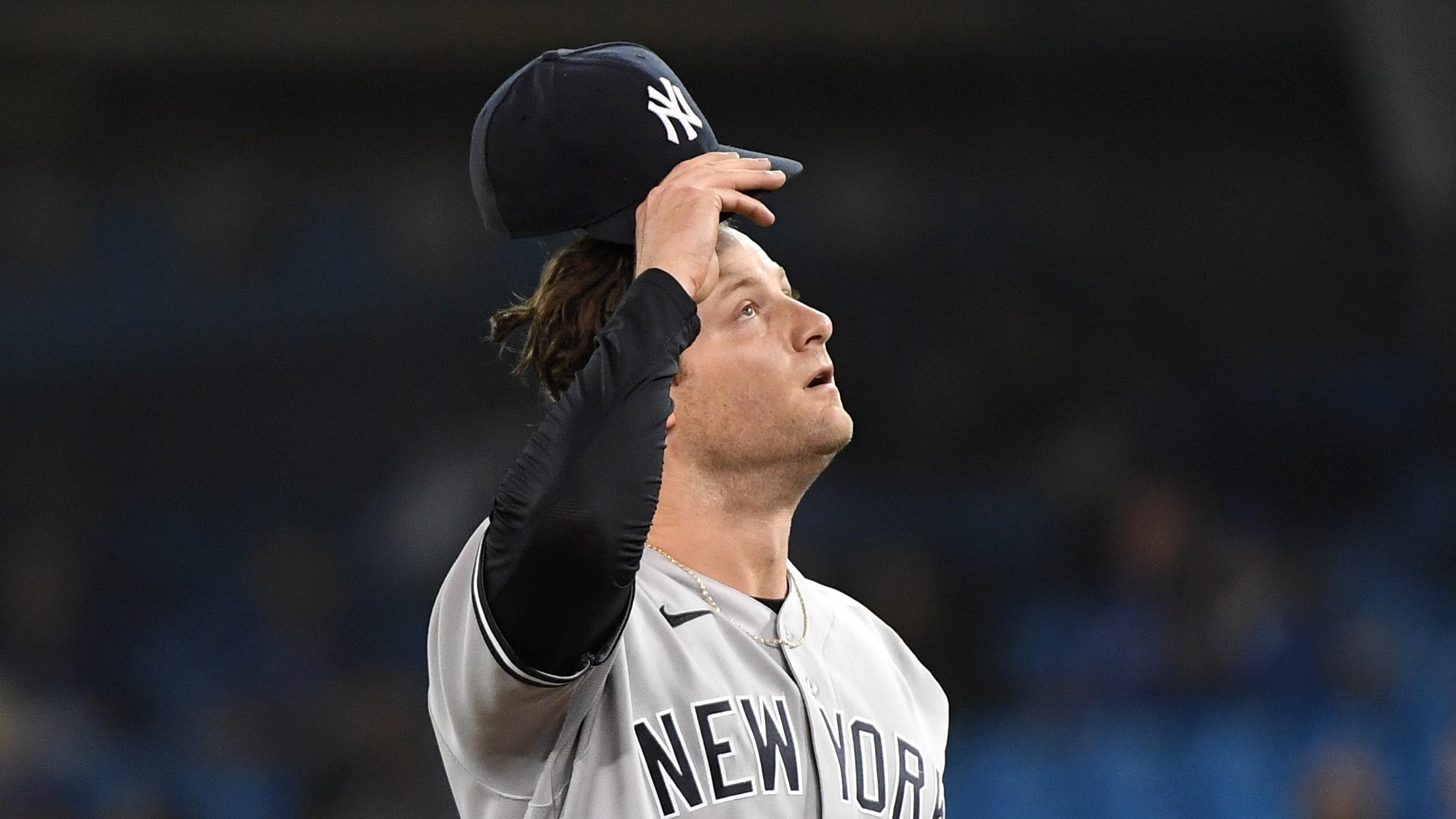 Sep 29, 2021; Toronto, Ontario, CAN; New York Yankees pitcher Gerrit Cole (45) reacts after giving up a double to Toronto Blue Jays shortstop Bo Bichette (not pictured) in the first inning at Rogers Centre. Mandatory Credit: Dan Hamilton-USA TODAY Sports