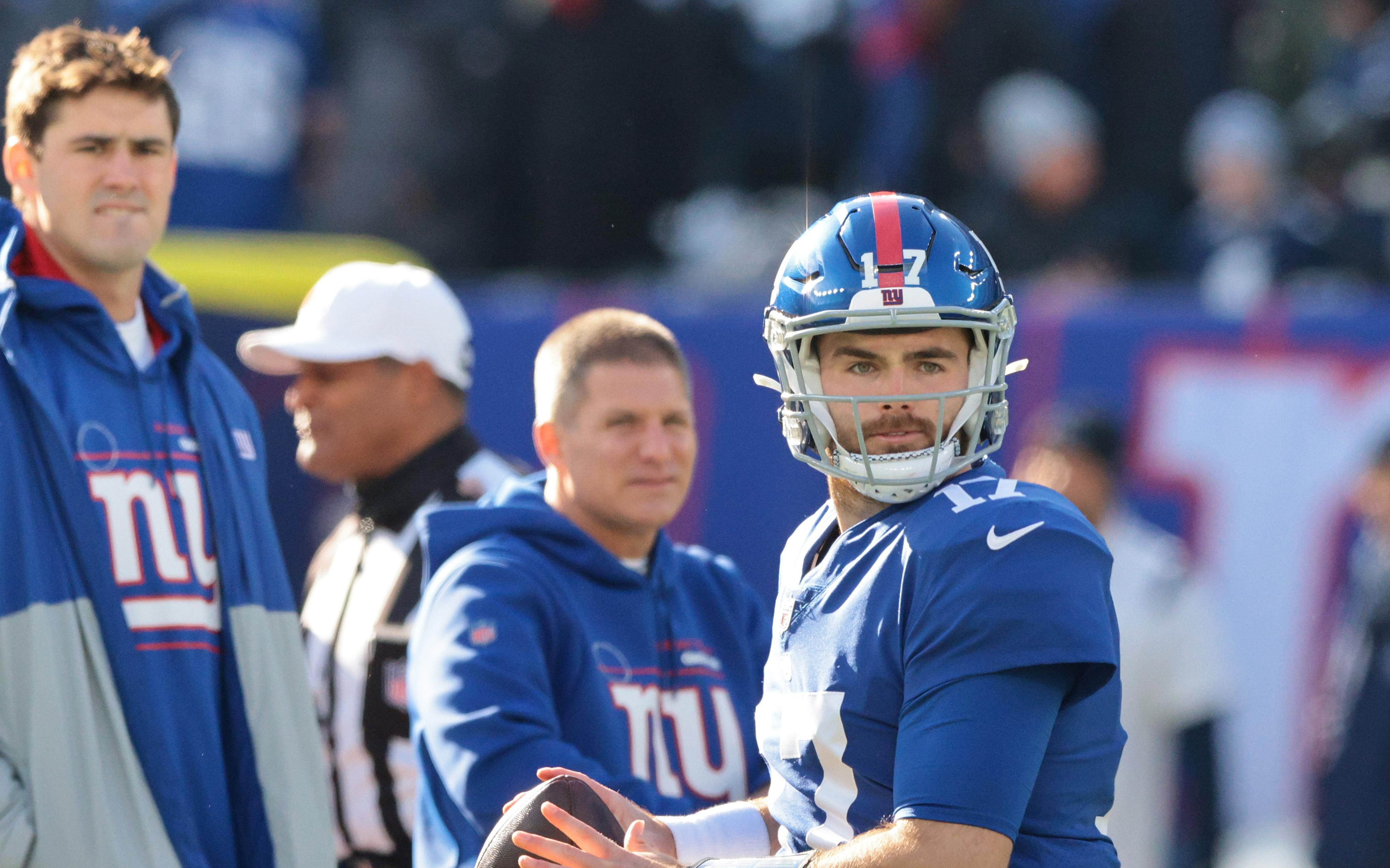 Dec 19, 2021; East Rutherford, New Jersey, USA; New York Giants quarterback Jake Fromm (17) throws the ball as quarterback Daniel Jones (8) looks on before the game against the Dallas Cowboys at MetLife Stadium. Mandatory Credit: Vincent Carchietta-USA TODAY Sports