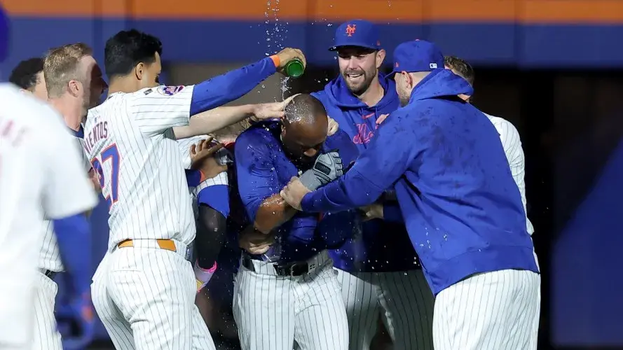 New York Mets right fielder Starling Marte (6) celebrates his tenth inning walkoff single against the Washington Nationals with teammates at Citi Field. / Brad Penner-Imagn Images