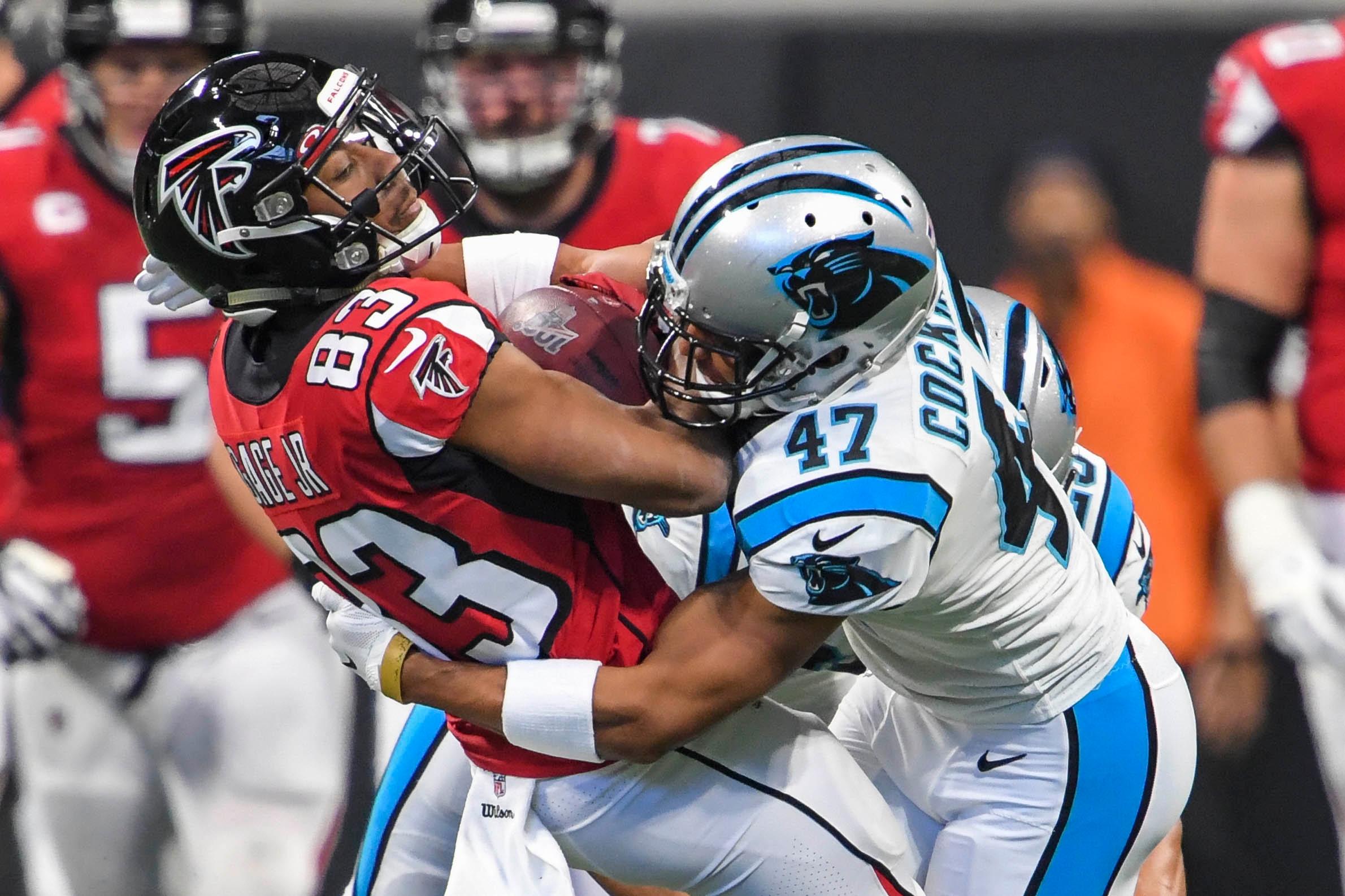 Dec 8, 2019; Atlanta, GA, USA; Atlanta Falcons wide receiver Russell Gage (83) is tackled by Carolina Panthers defensive back Ross Cockrell (47) during the first half at Mercedes-Benz Stadium.