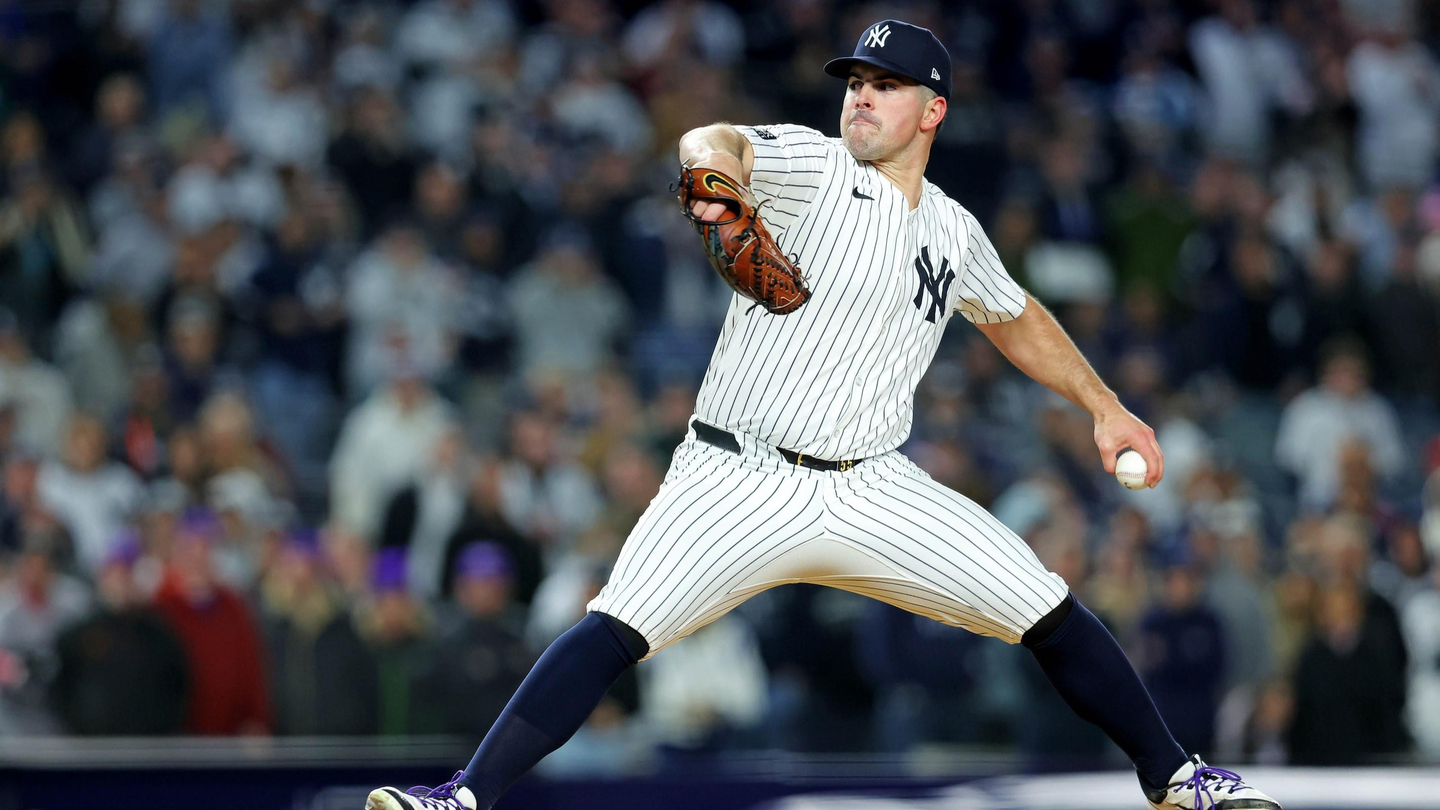 Oct 14, 2024; Bronx, New York, USA; New York Yankees pitcher Carlos Rodón (55) pitches during the first inning against the Cleveland Guardians in game one of the ALCS for the 2024 MLB Playoffs at Yankee Stadium. 