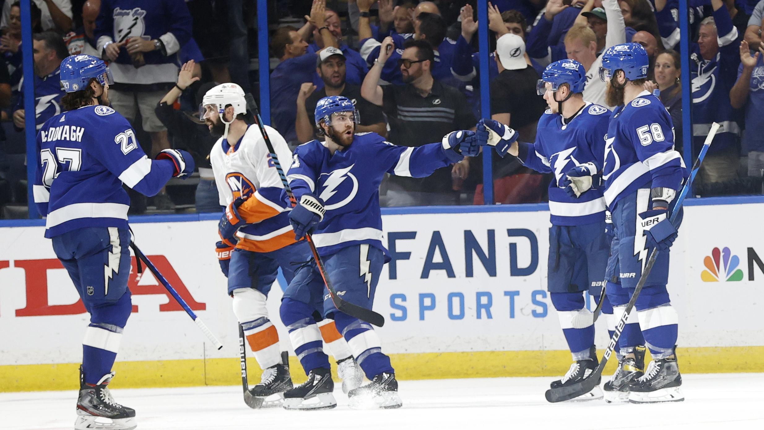 Jun 21, 2021; Tampa, Florida, USA; Tampa Bay Lightning left wing Ondrej Palat (18) is congratulated as he scored s goal against the New York Islanders during the second period in game five of the Stanley Cup Semifinals at Amalie Arena.