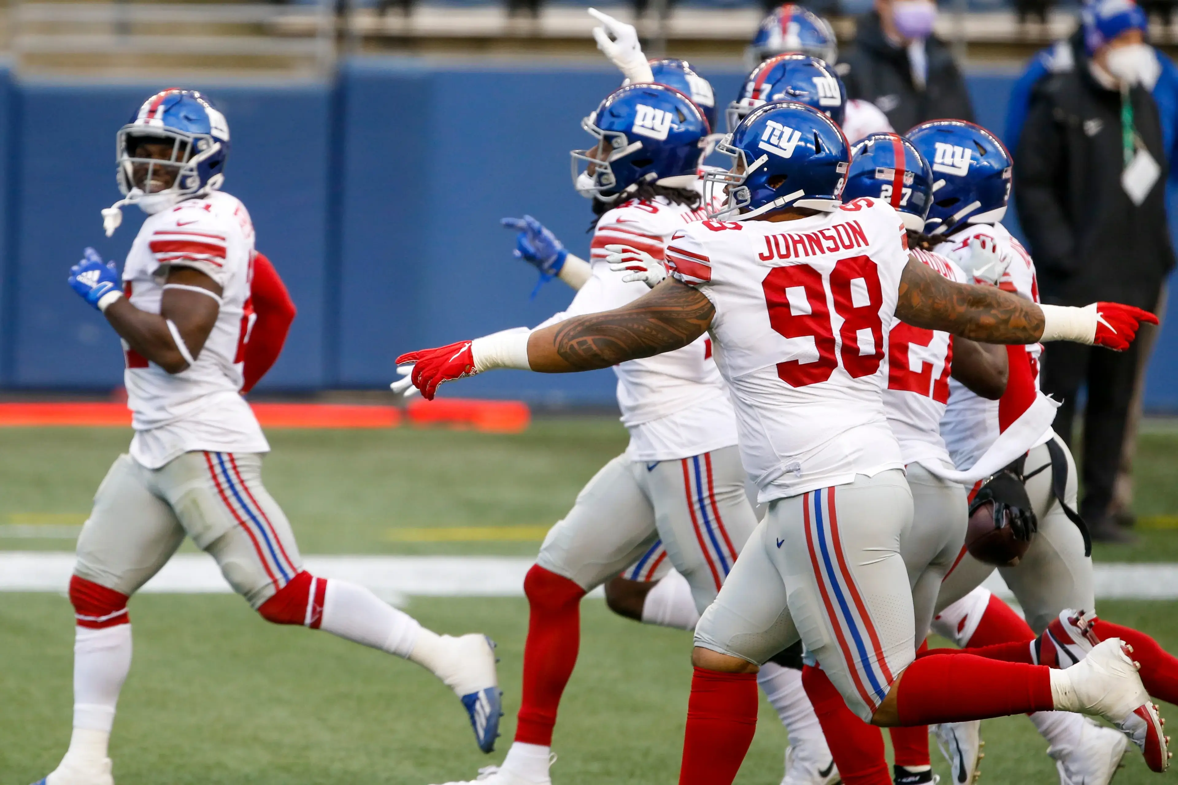 Dec 6, 2020; Seattle, Washington, USA; New York Giants nose tackle Austin Johnson (98) celebrates following an interception against the Seattle Seahawks during the fourth quarter at Lumen Field. / © Joe Nicholson-USA TODAY Sports