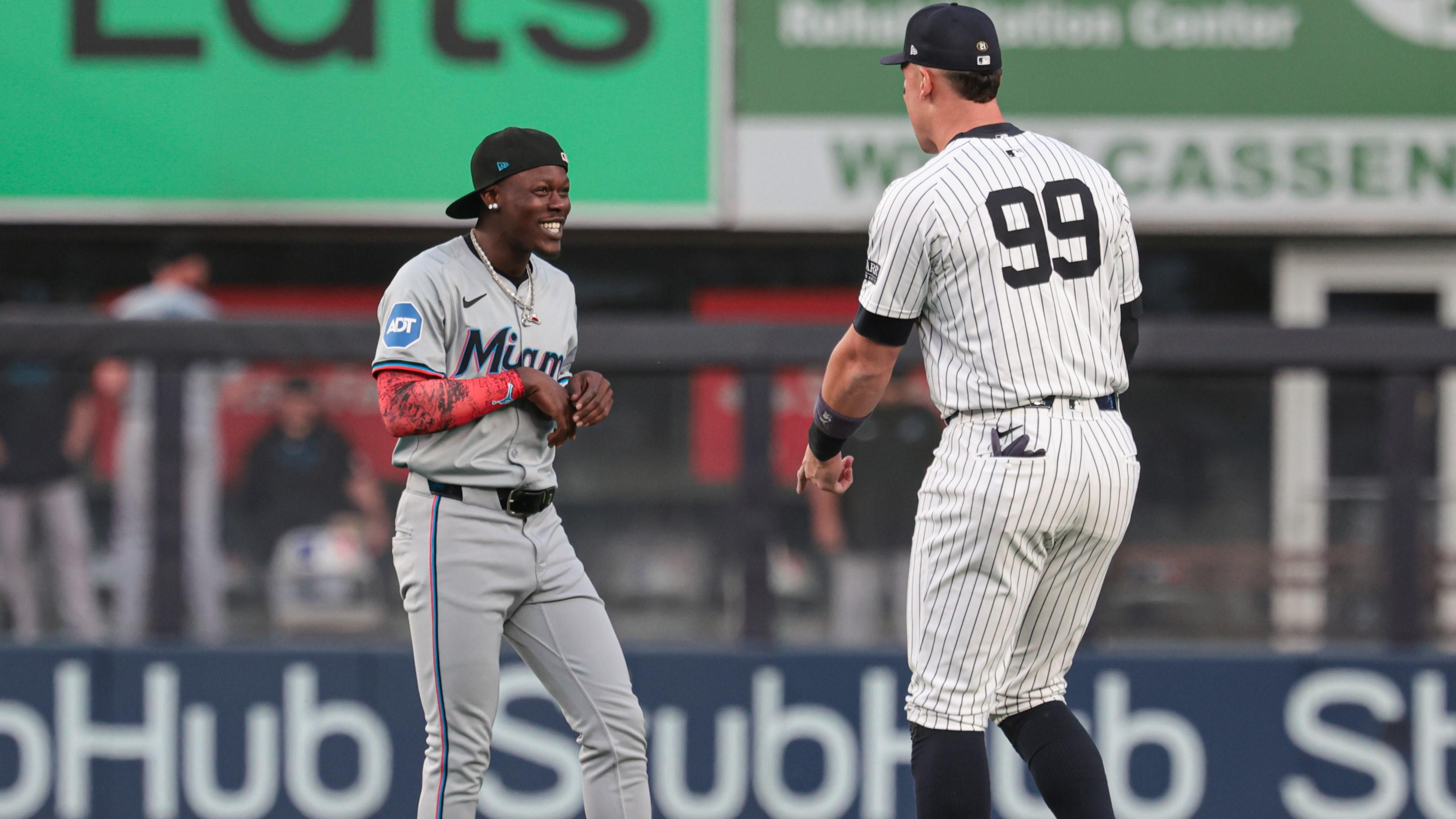 Apr 9, 2024; Bronx, New York, USA; New York Yankees center fielder Aaron Judge (99) talks with Miami Marlins center fielder Jazz Chisholm Jr. (2) before the game at Yankee Stadium. Mandatory Credit: Vincent Carchietta-USA TODAY Sports