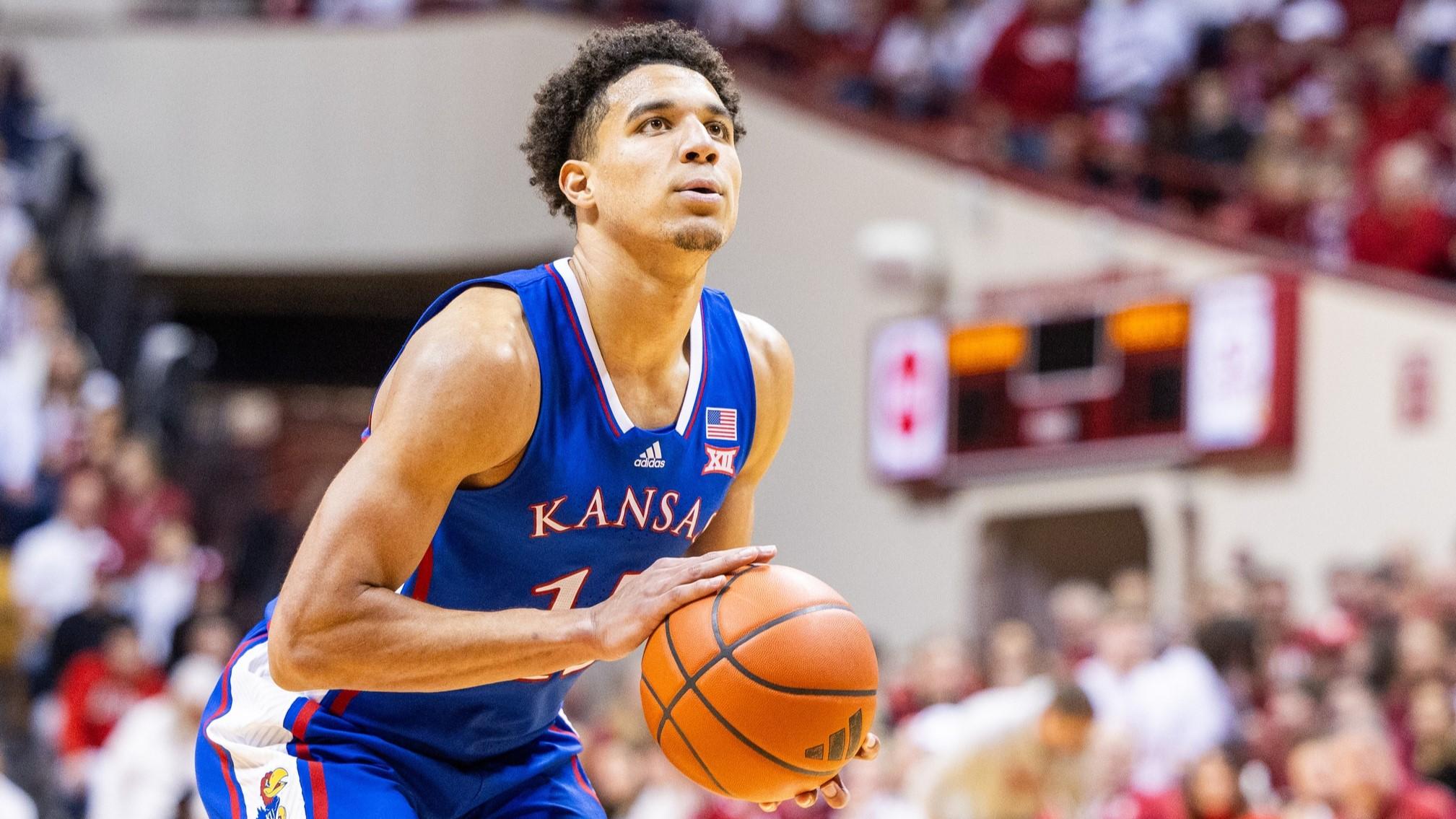 Dec 16, 2023; Bloomington, Indiana, USA; Kansas Jayhawks guard Kevin McCullar Jr. (15) shoots the ball in the second half against the Indiana Hoosiers at Simon Skjodt Assembly Hall.