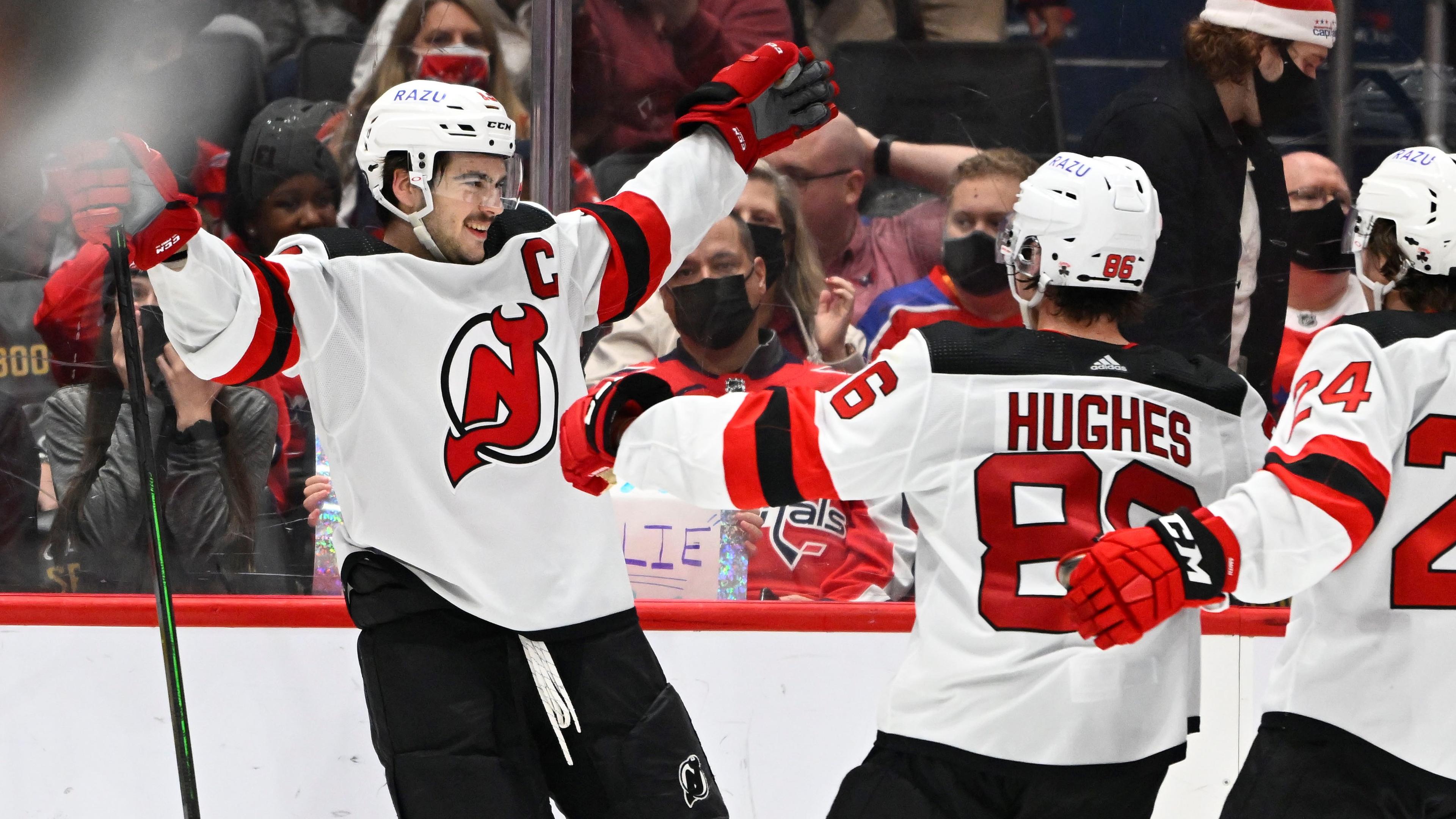 Jan 2, 2022; Washington, District of Columbia, USA; New Jersey Devils center Nico Hischier (13) reacts after scoring the game winning goal against the Washington Capitals during the overtime period at Capital One Arena. Mandatory Credit: Brad Mills-USA TODAY Sports