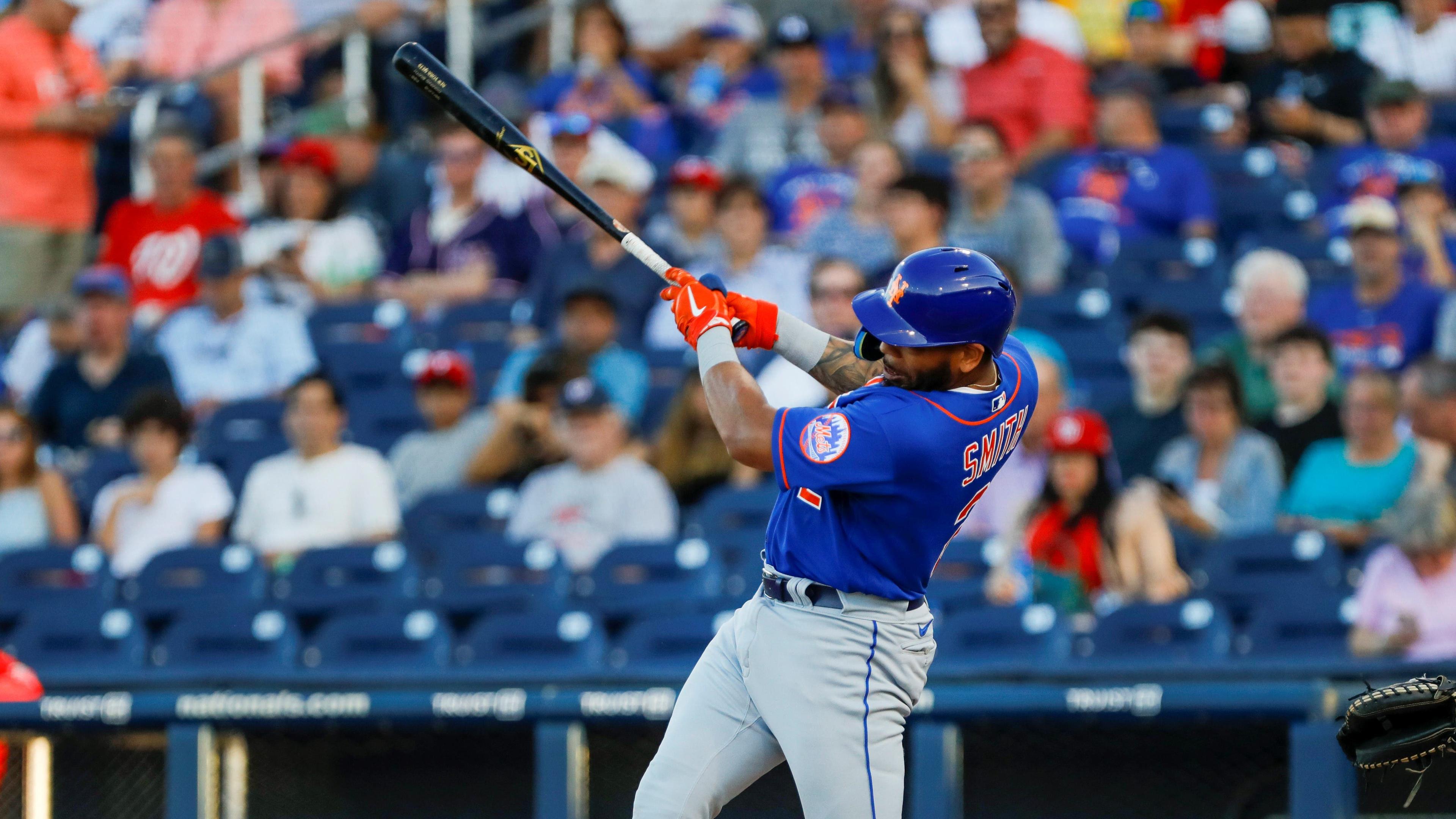 Mar 19, 2022; West Palm Beach, Florida, USA; New York Mets left fielder Dominic Smith (2) connects for a triple in the third inning of the game against the Washington Nationals during spring training at The Ballpark of the Palm Beaches. Mandatory Credit: Sam Navarro-USA TODAY Sports / Sam Navarro-USA TODAY Sports